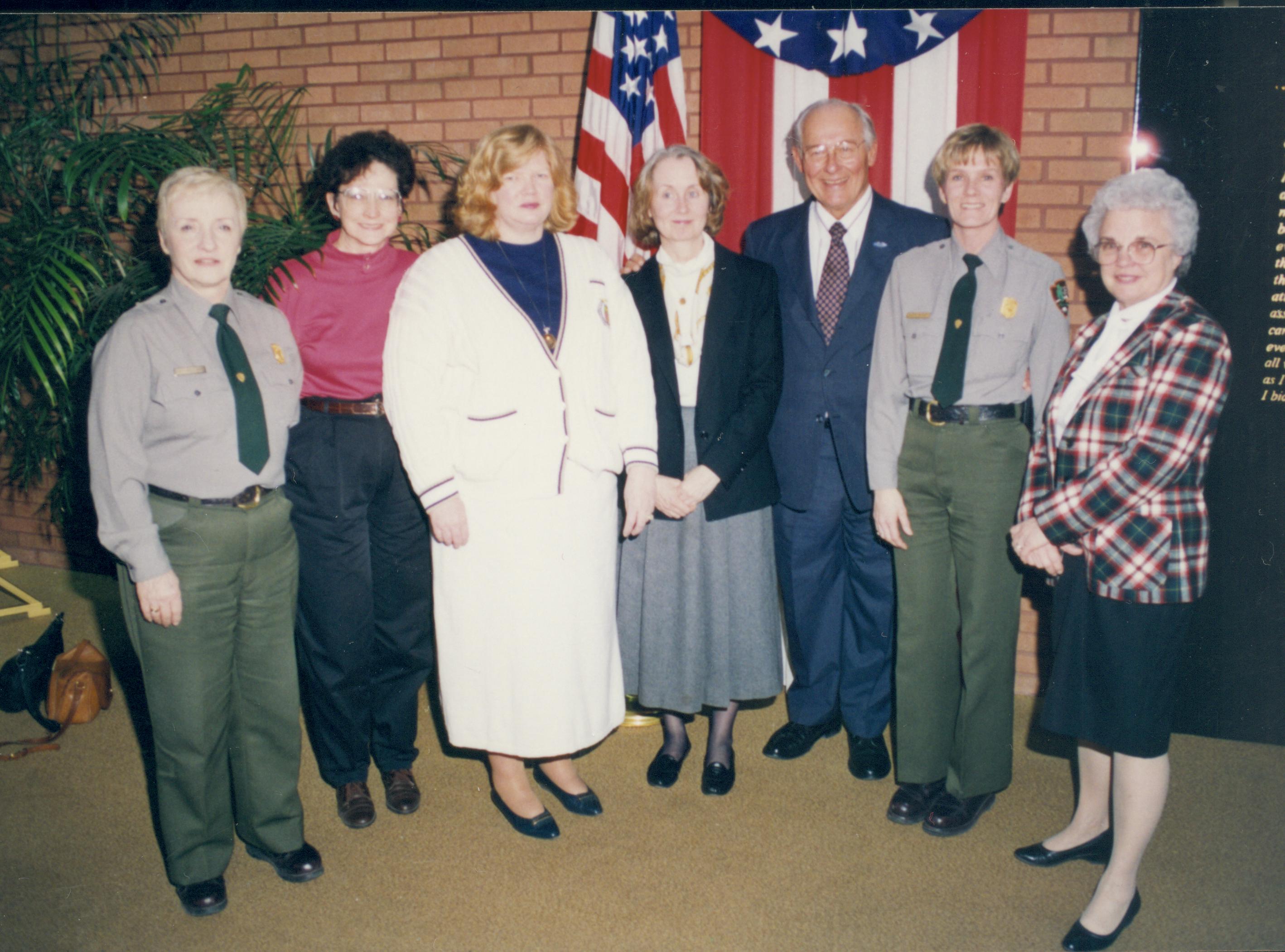 Group posing in front of American flag & bunting. Lincoln Home NHS- VIP Findley and Michel Visit visit, program