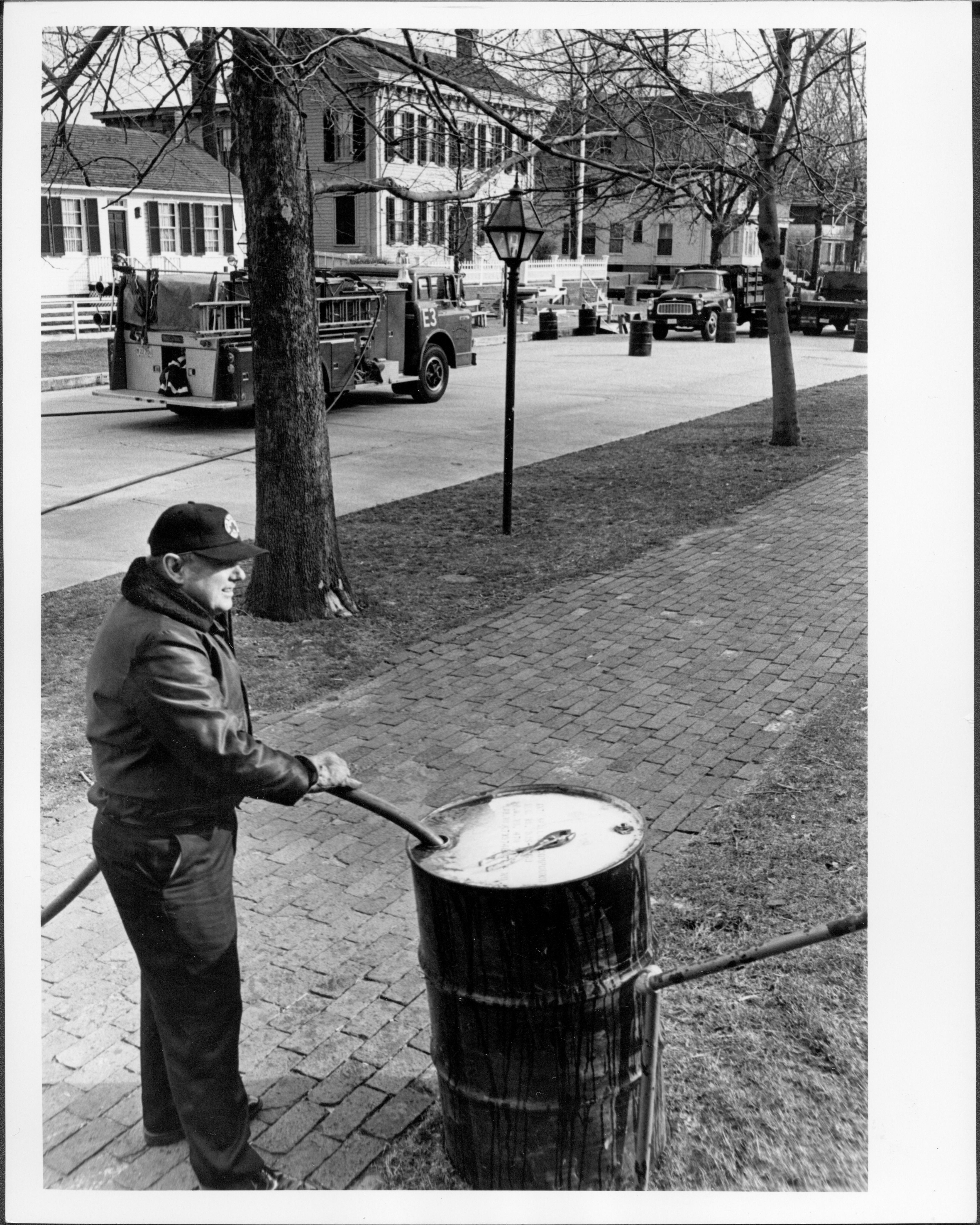 Springfield fireman filling up barrell to be used to anchor rope to control crowds Lincoln Home NHS- President Ford and V.C. Corner Stone, class 1000, class 8 pic 1 President, Ford, visit, dedication