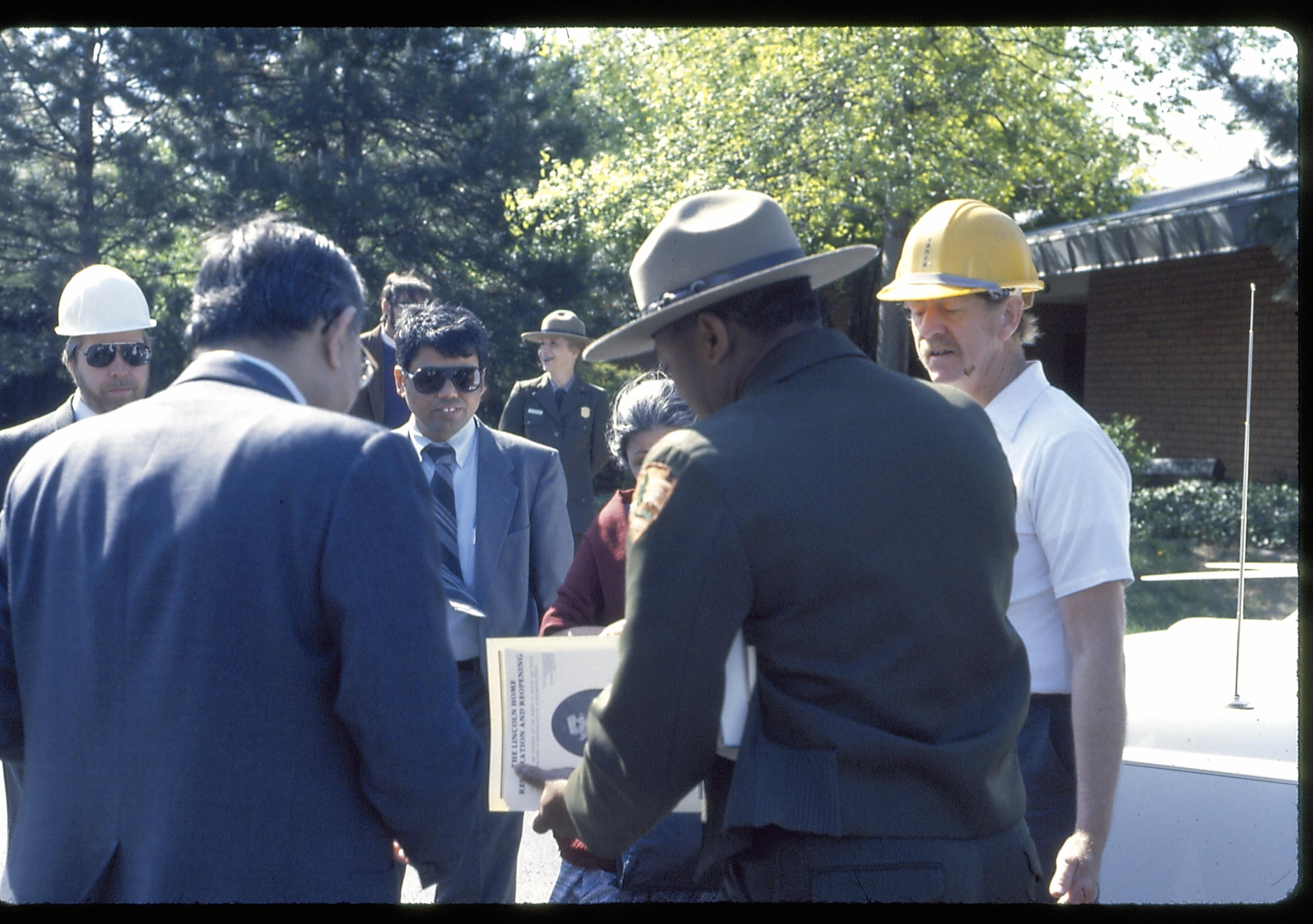 Group listening to Ranger, who is holding booklet. Lincoln Home NHS- Foreign Dignitary Visit dignitary, visit, tour