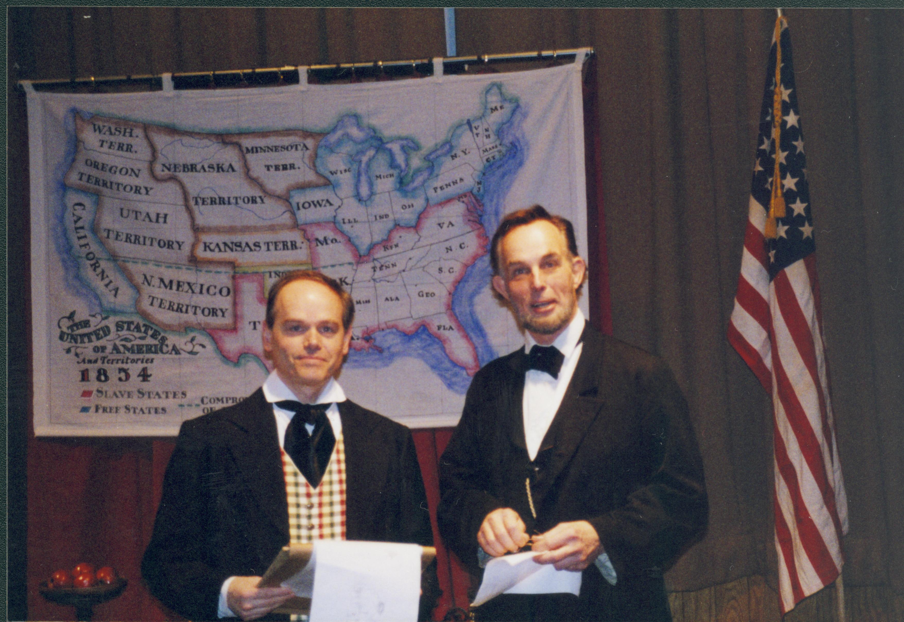 Two men in front of map Lincoln Home NHS- Fritz Klein and Drew Gibson visit, roll 2002-1, exp 14 Klein, Gibson, visit