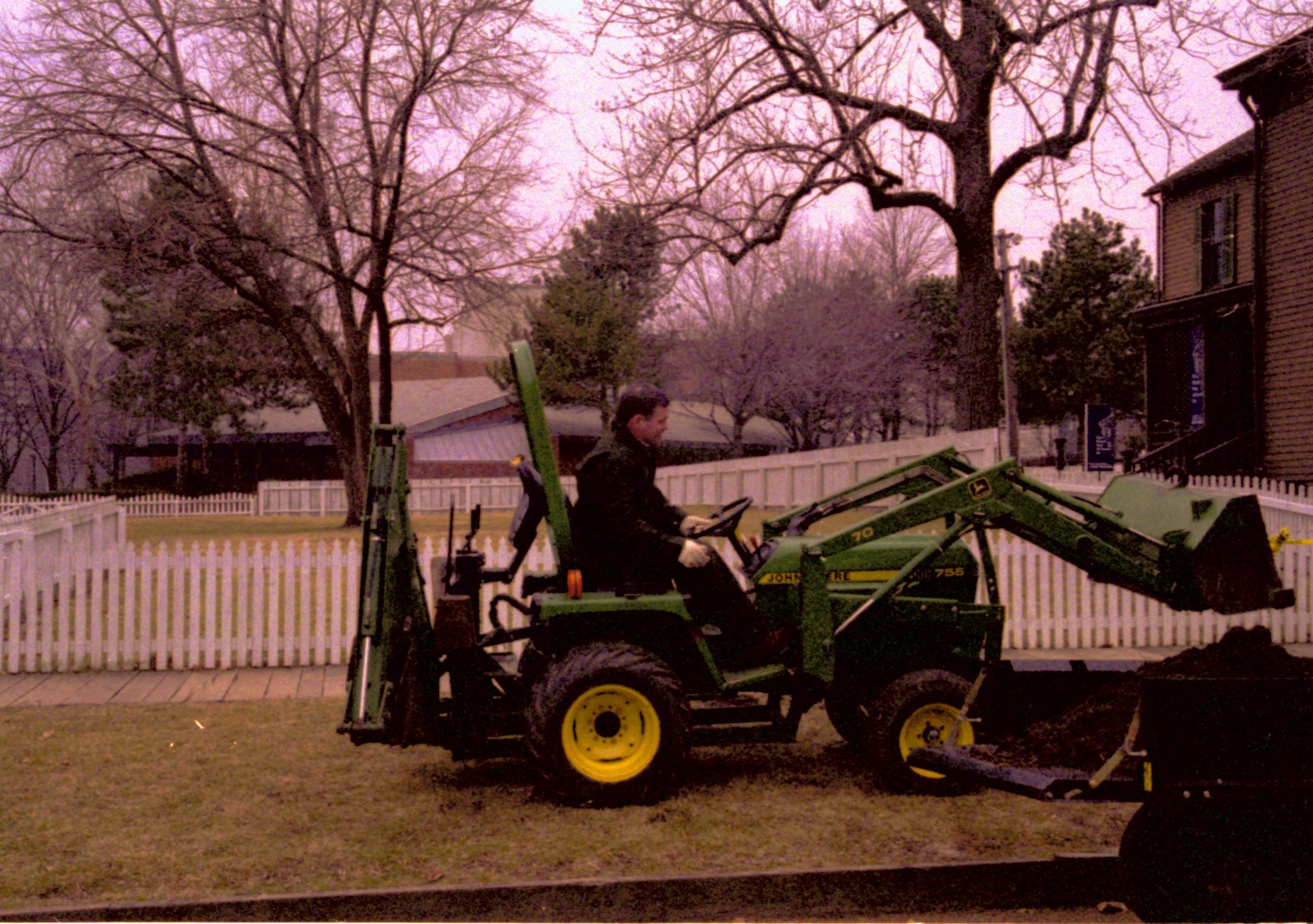 Man operating end loader. Lincoln Home NHS- Fritz Klein and Drew Gibson visit, roll 2002-1 tractor, repairs