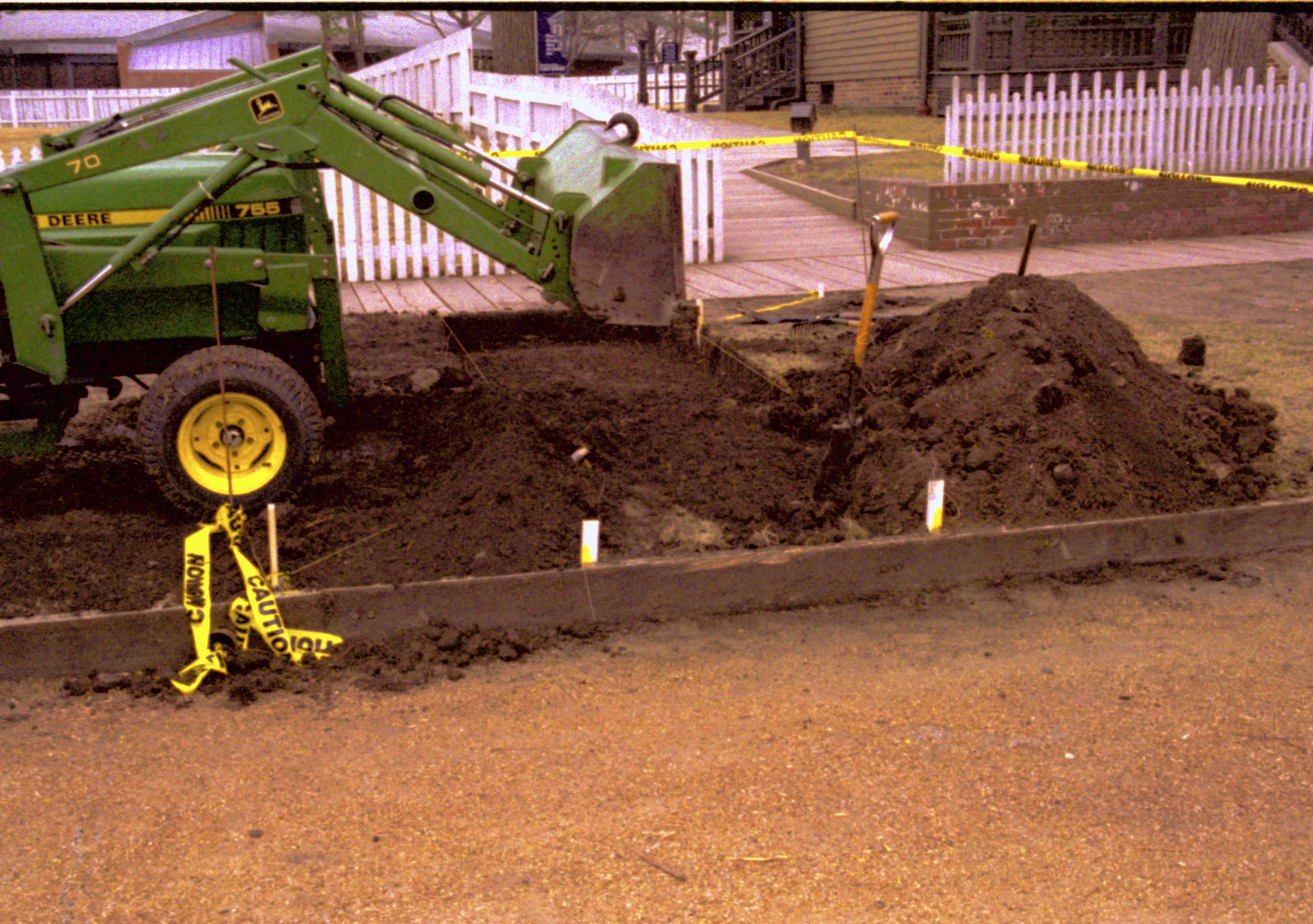 End loader moving dirt. Lincoln Home NHS- Fritz Klein and Drew Gibson visit, roll 2002-1 tractor, repairs, excavation