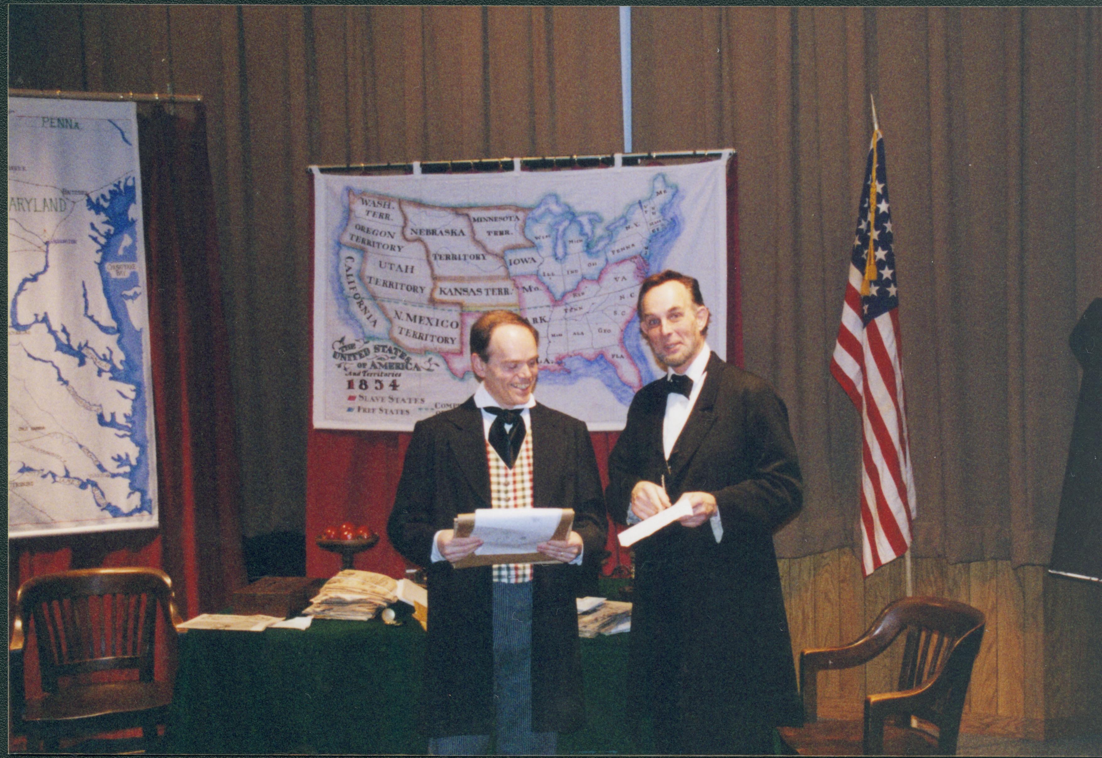 Fritz Klein and Drew Gibson in discussion in front of U.S. map. Lincoln Home NHS- Fritz Klein and Drew Gibson visit, roll 2002-1, exp 11 Klein, Gibson, visit