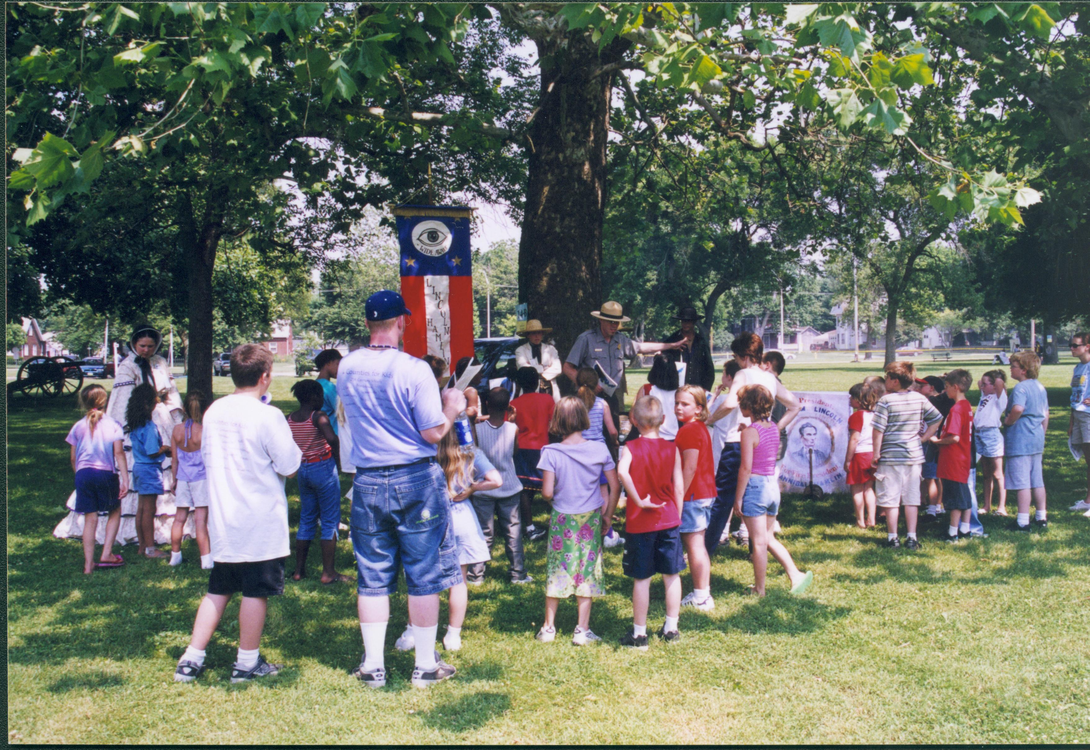 Children standing under tree with Ranger. Lincoln Home NHS- Grierson Days Jacksonville Grierson, Jacksonville, celebration