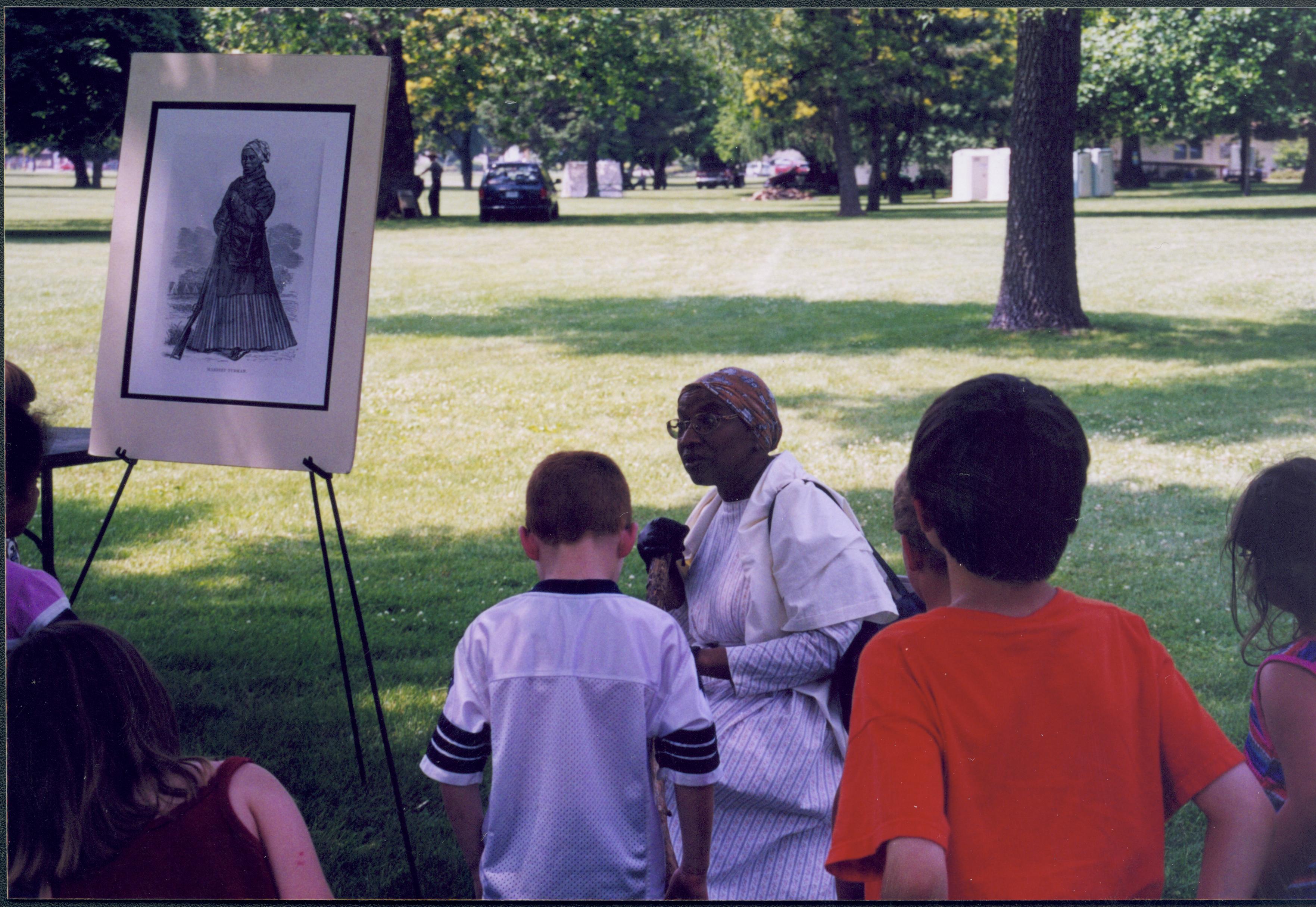 Children listening to lady seated in period dress. Lincoln Home NHS- Grierson Days Jacksonville Grierson, Jacksonville, celebration