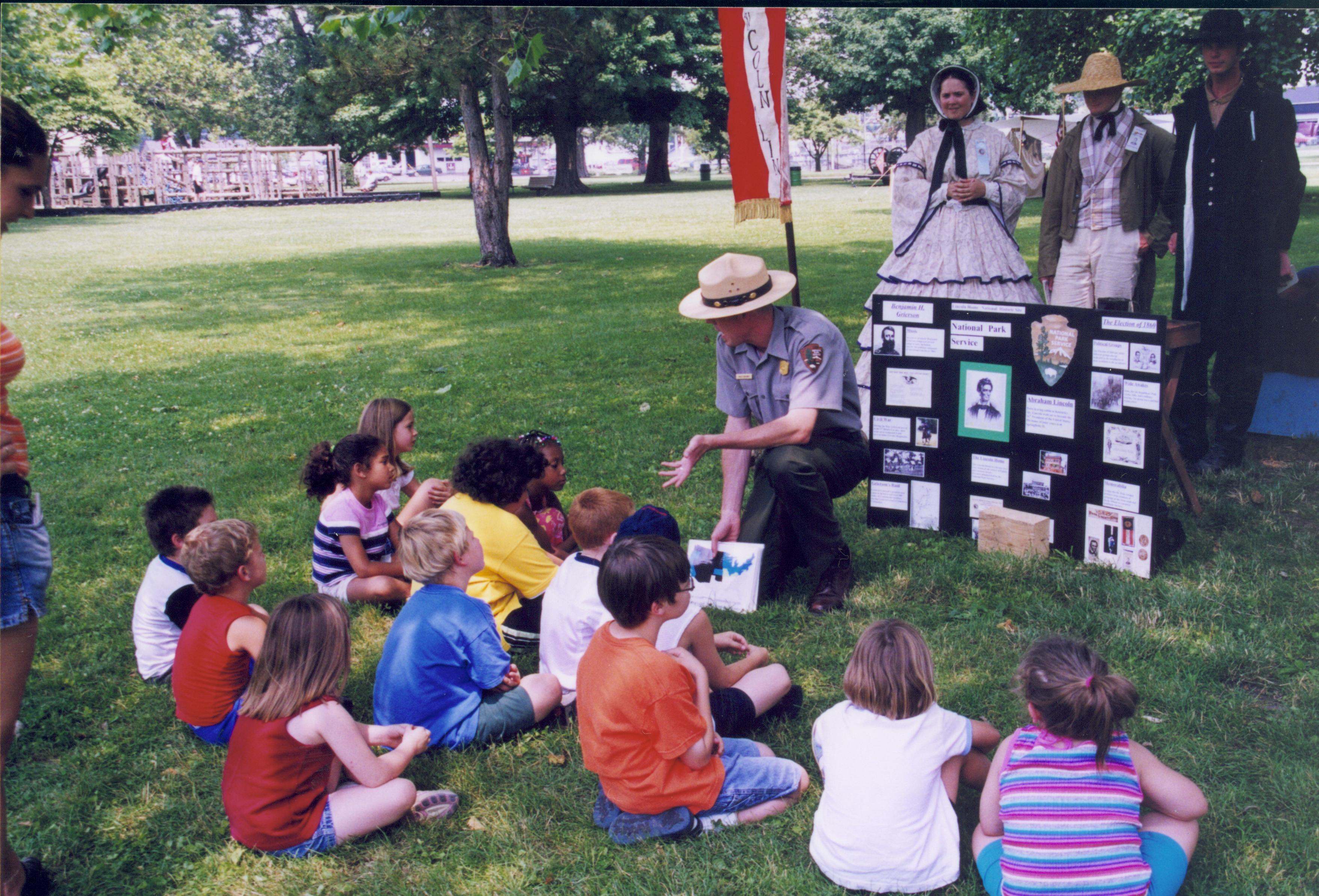 Children seated listening to Ranger. Lincoln Home NHS- Grierson Days Jacksonville Grierson, Jacksonville, celebration