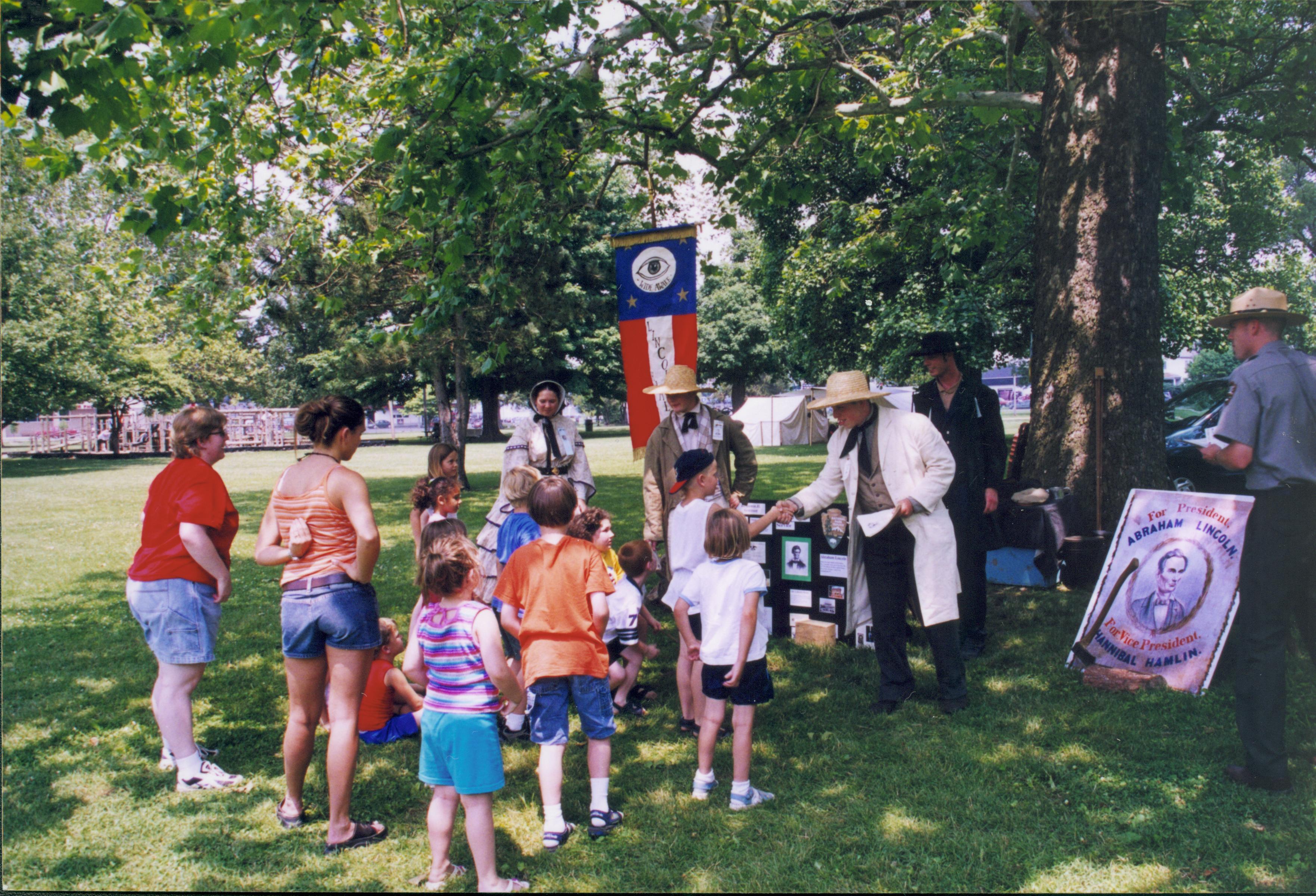 Children talking to people in period dress. Lincoln Home NHS- Grierson Days Jacksonville Grierson, Jacksonville, celebration