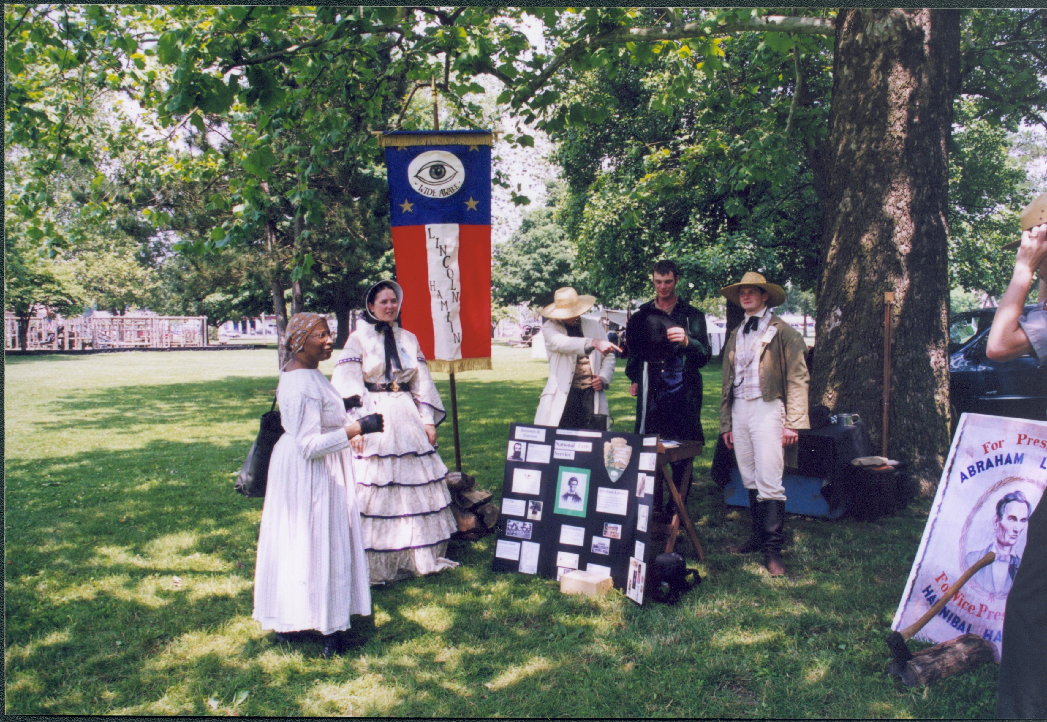 People in period dress in front of poster/pictures. Lincoln Home NHS- Grierson Days Jacksonville Grierson, Jacksonville, celebration