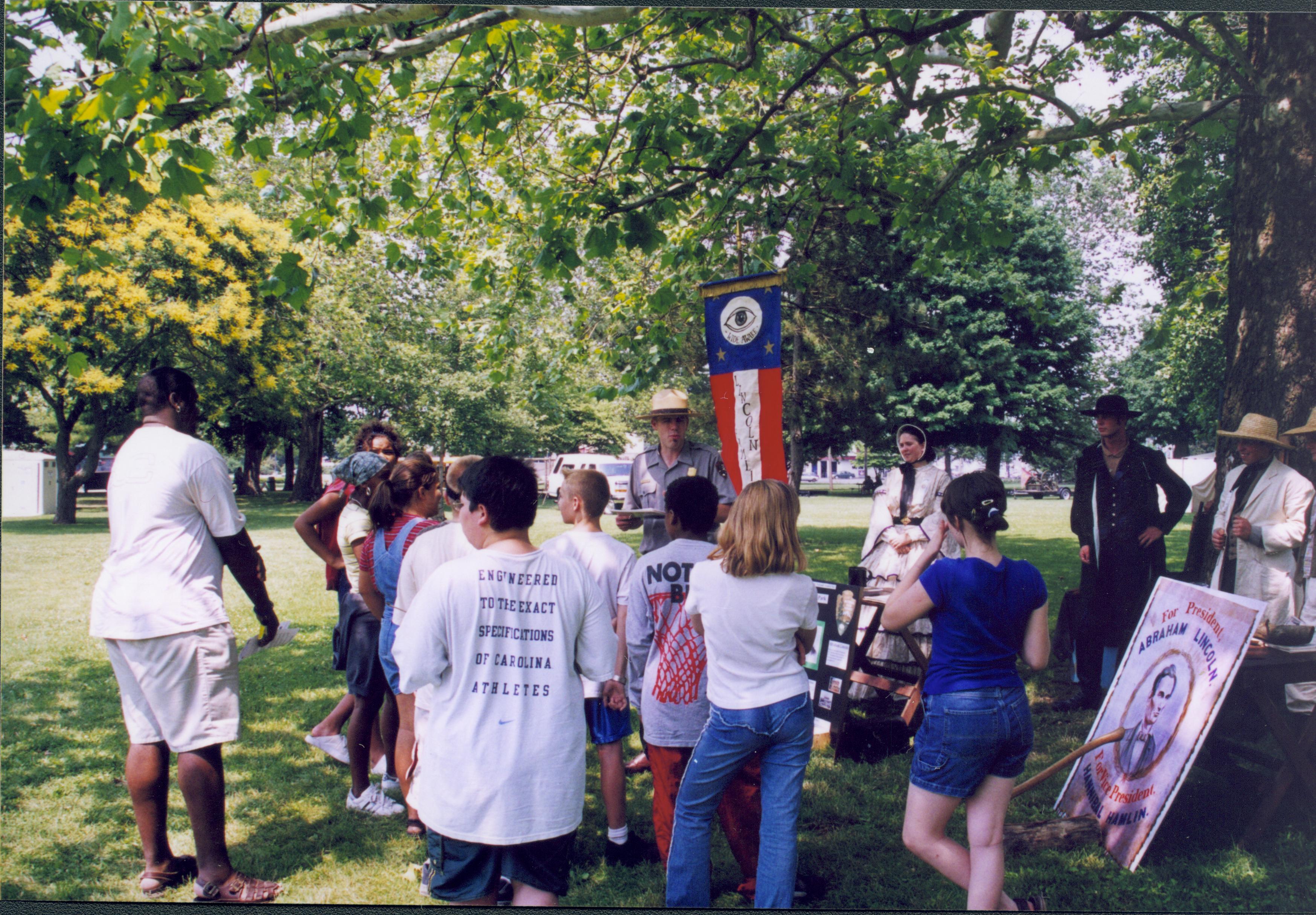 Group of children in front of Ranger and period dress participants. Lincoln Home NHS- Grierson Days Jacksonville Grierson, Jacksonville, celebration