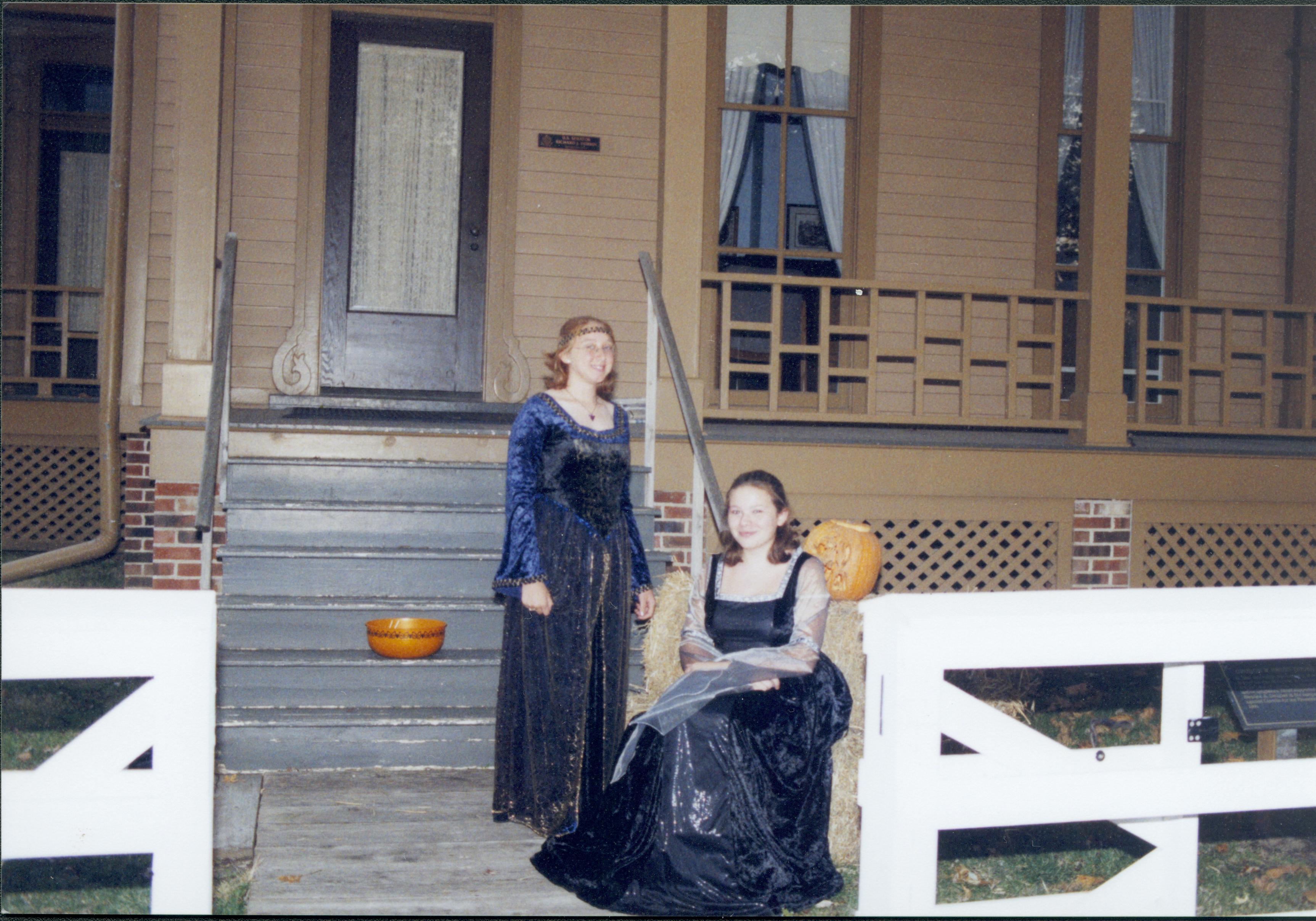 Two yound ladies in renaisance dress in front of the Dubois house.. Lincoln Home NHS- Halloween halloween, costumes, decorations