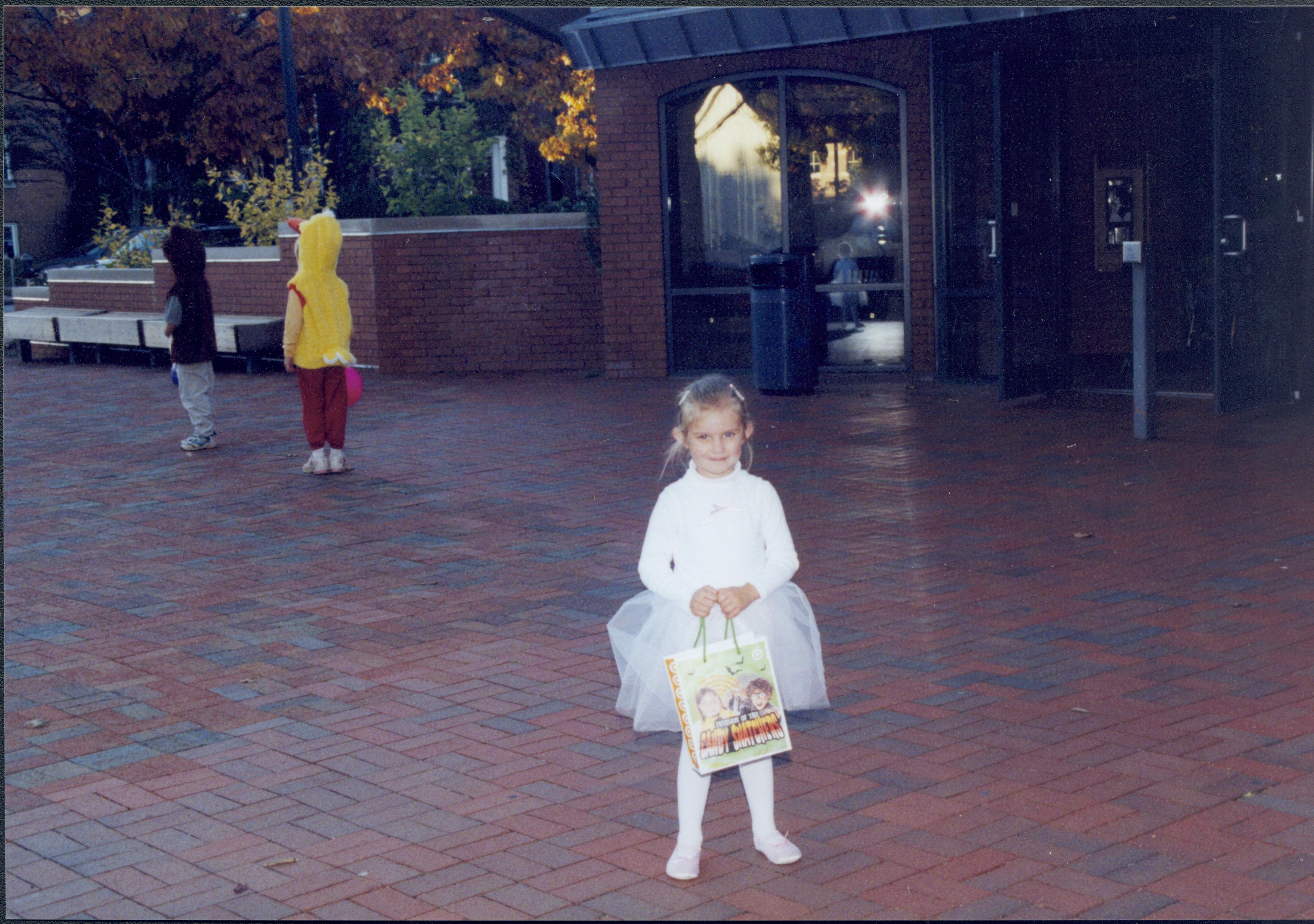 Little girl dressed in costume holding bag (ourside VC) Lincoln Home NHS- Halloween halloween, costumes, decorations