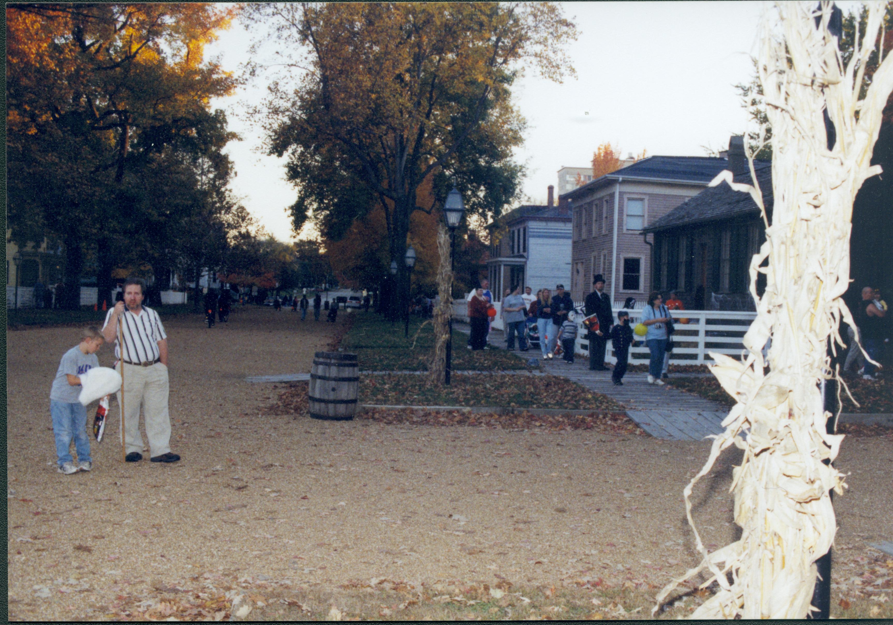 Visitors waalking down boardwalk by Corneau house. Lincoln Home NHS- Halloween halloween, costumes, decorations