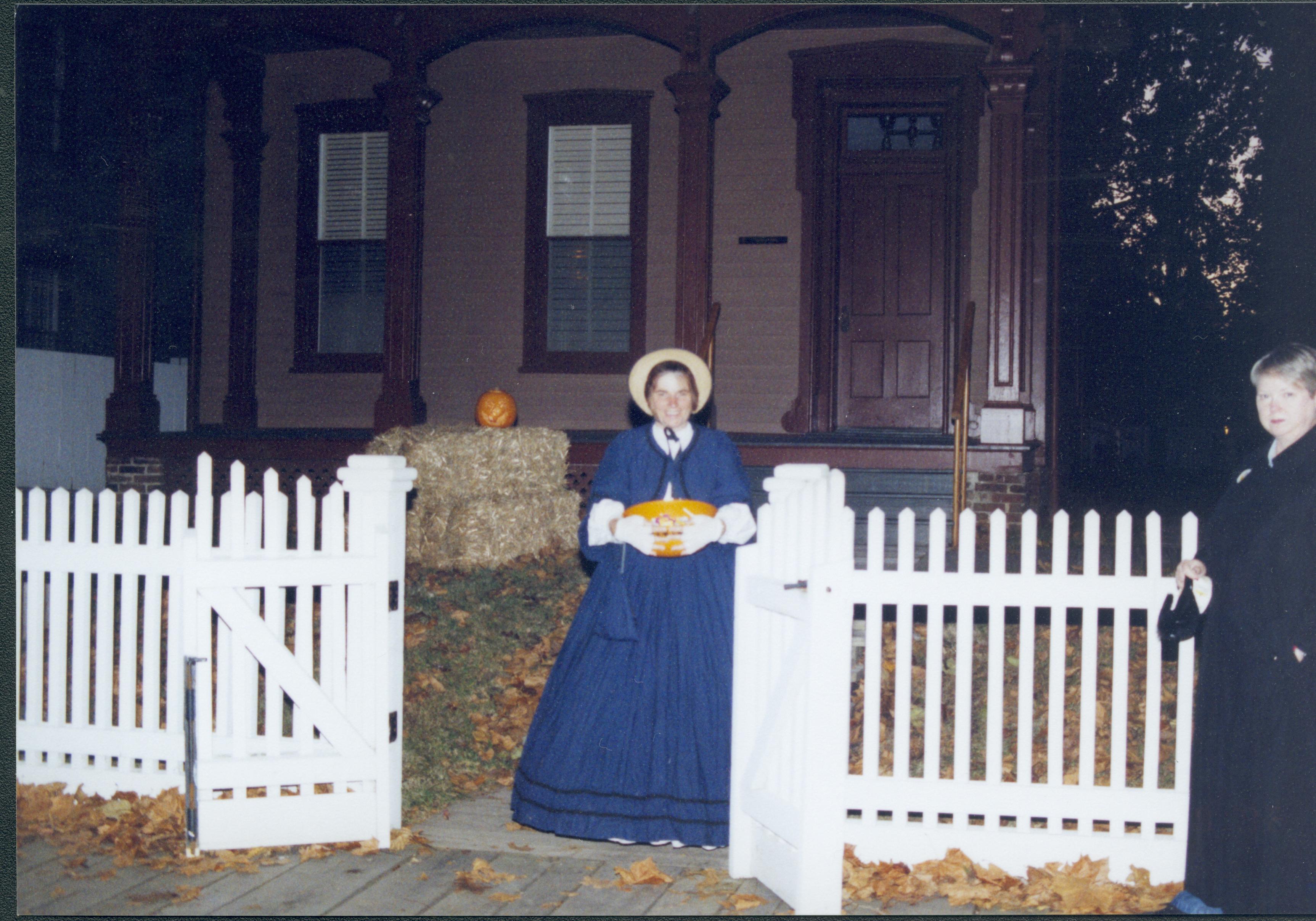 Lady in blue period dress standing in gateway. Lincoln Home NHS- Halloween halloween, costumes, decorations