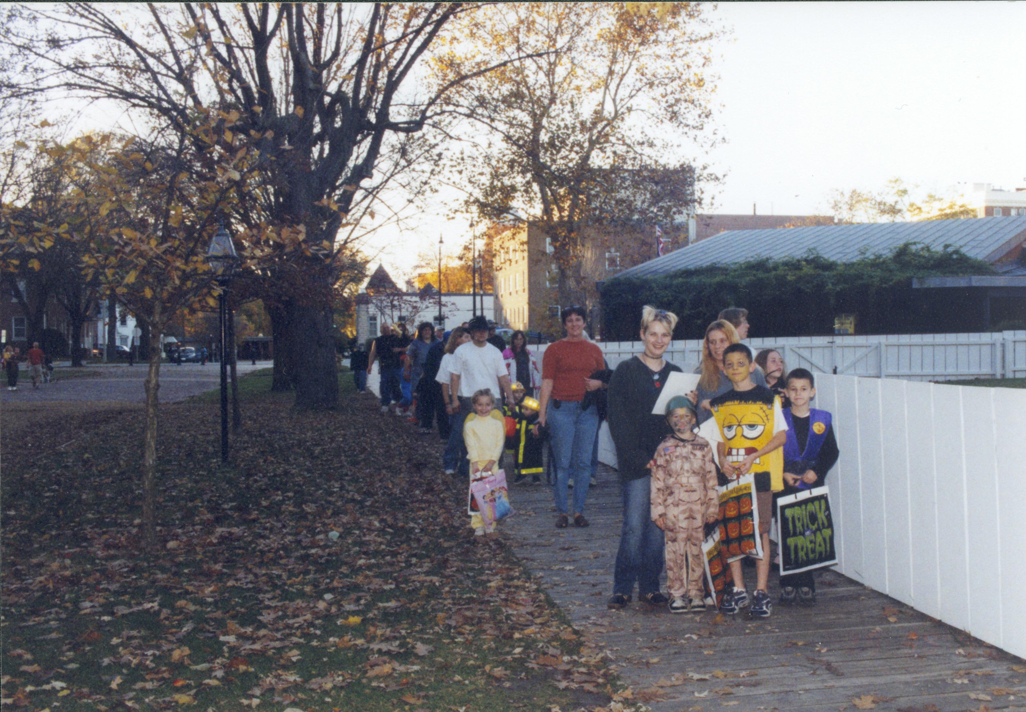 Group in costime walking down board walk from VC. Lincoln Home NHS- Halloween halloween, costumes, decorations