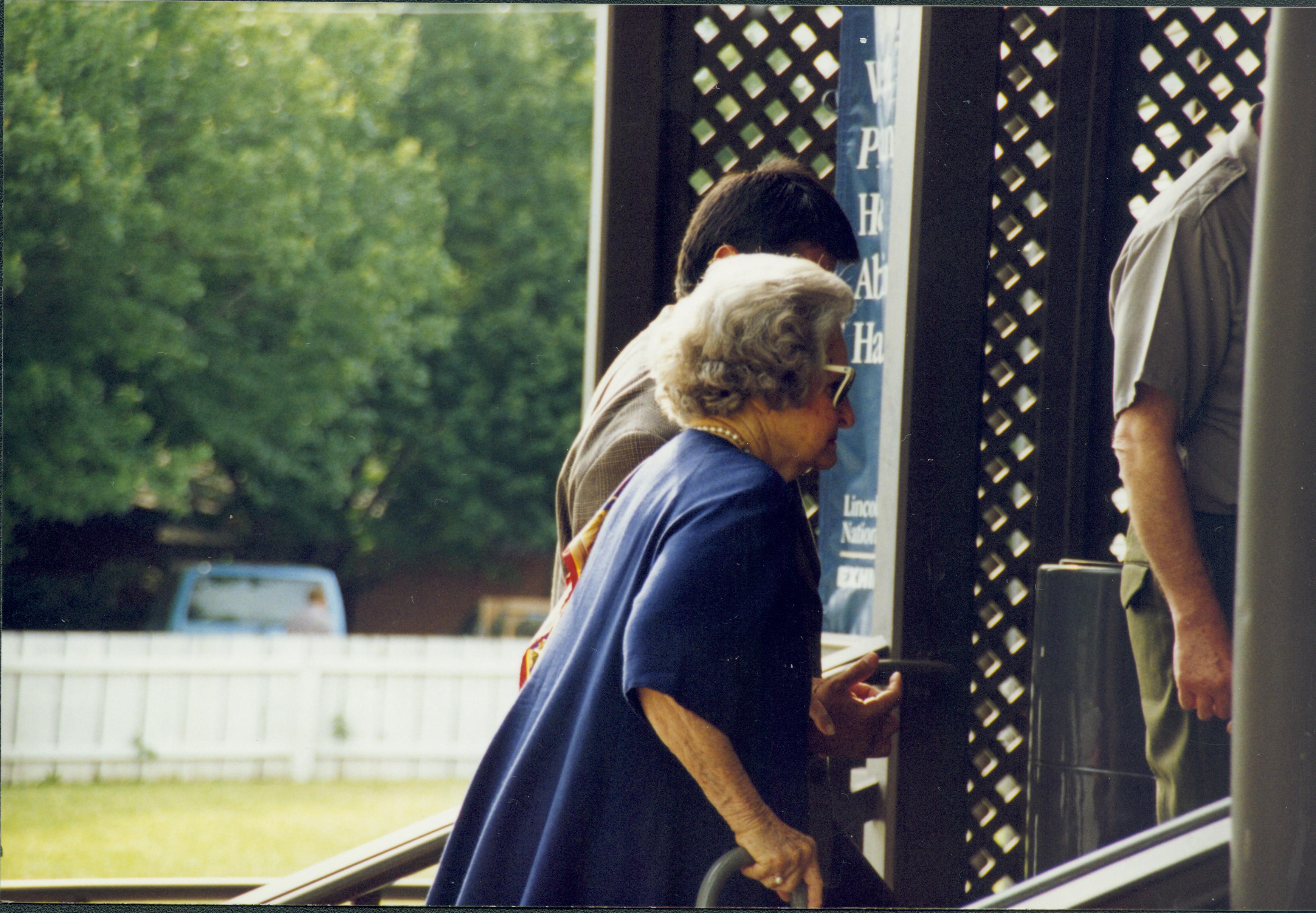 Lady going in side enterance of Dean house. Lincoln Home NHS- Lady Bird Johnson visit, roll #1 neg #18 Johnson, visit, tour