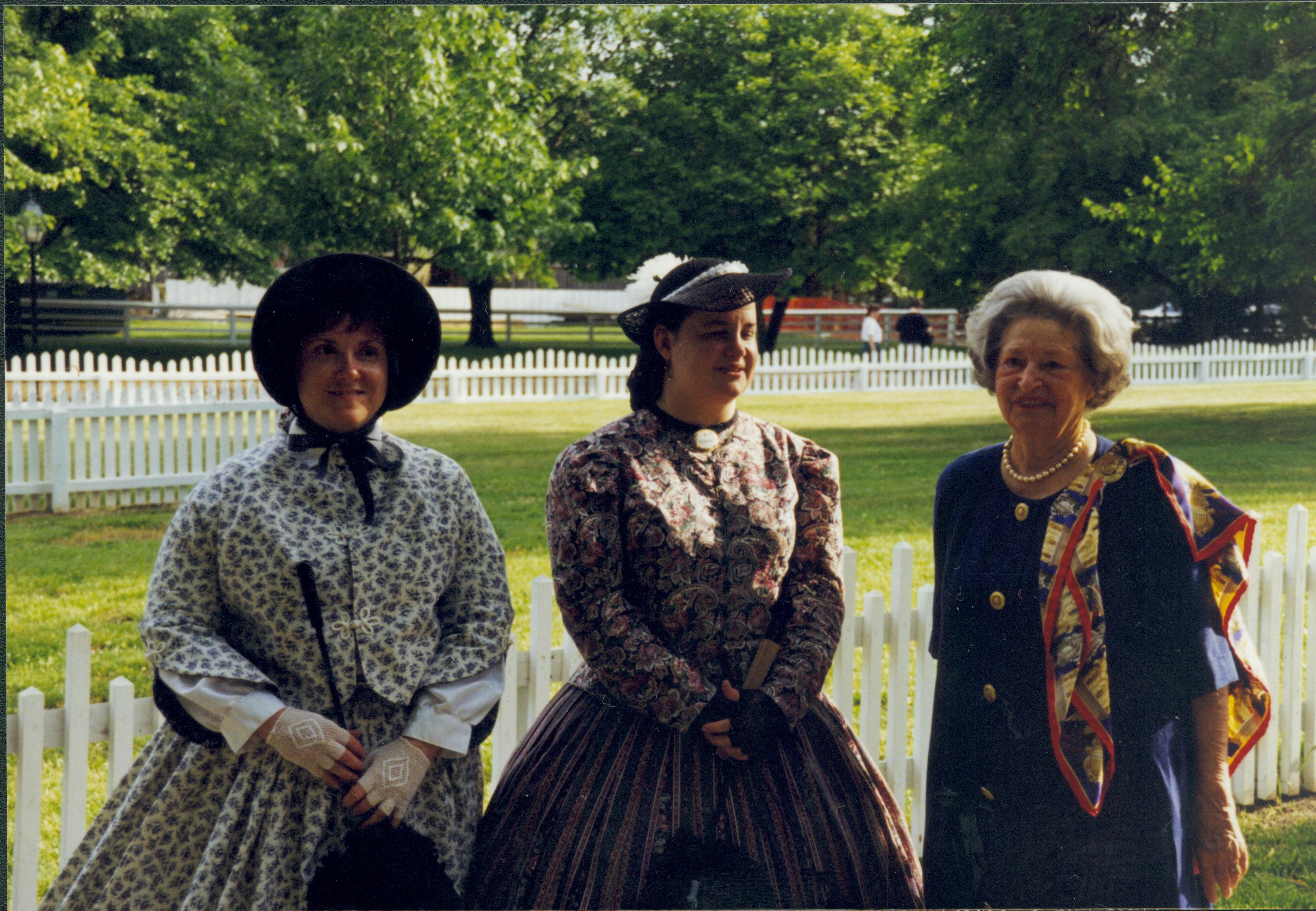 Three ladies (two in period dress) Lincoln Home NHS- Lady Bird Johnson visit, roll #1 neg #19 Johnson, visit, tour