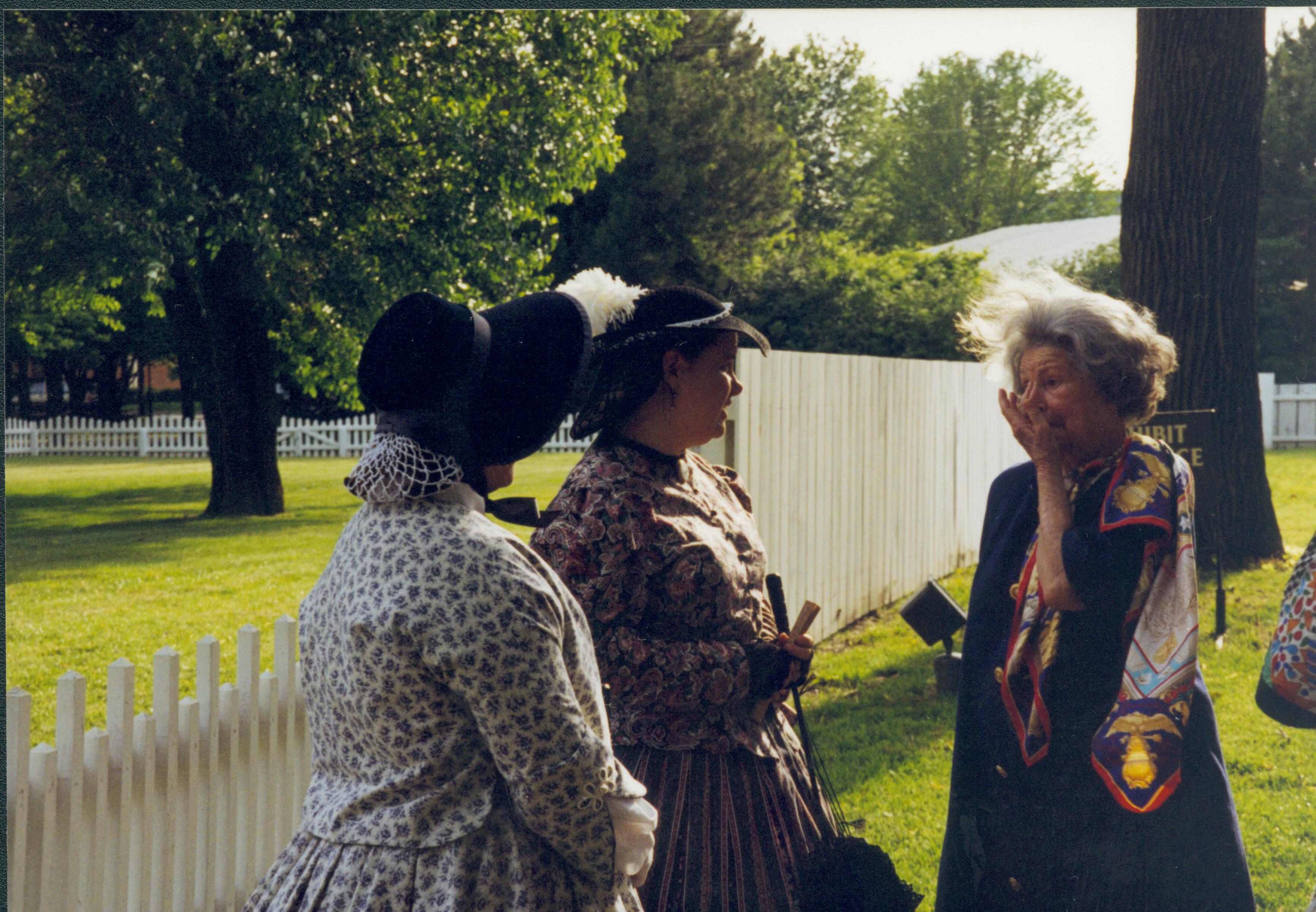 Three ladies (two in period dress) Lincoln Home NHS- Lady Bird Johnson visit, roll #1 neg #21 Johnson, visit, tour