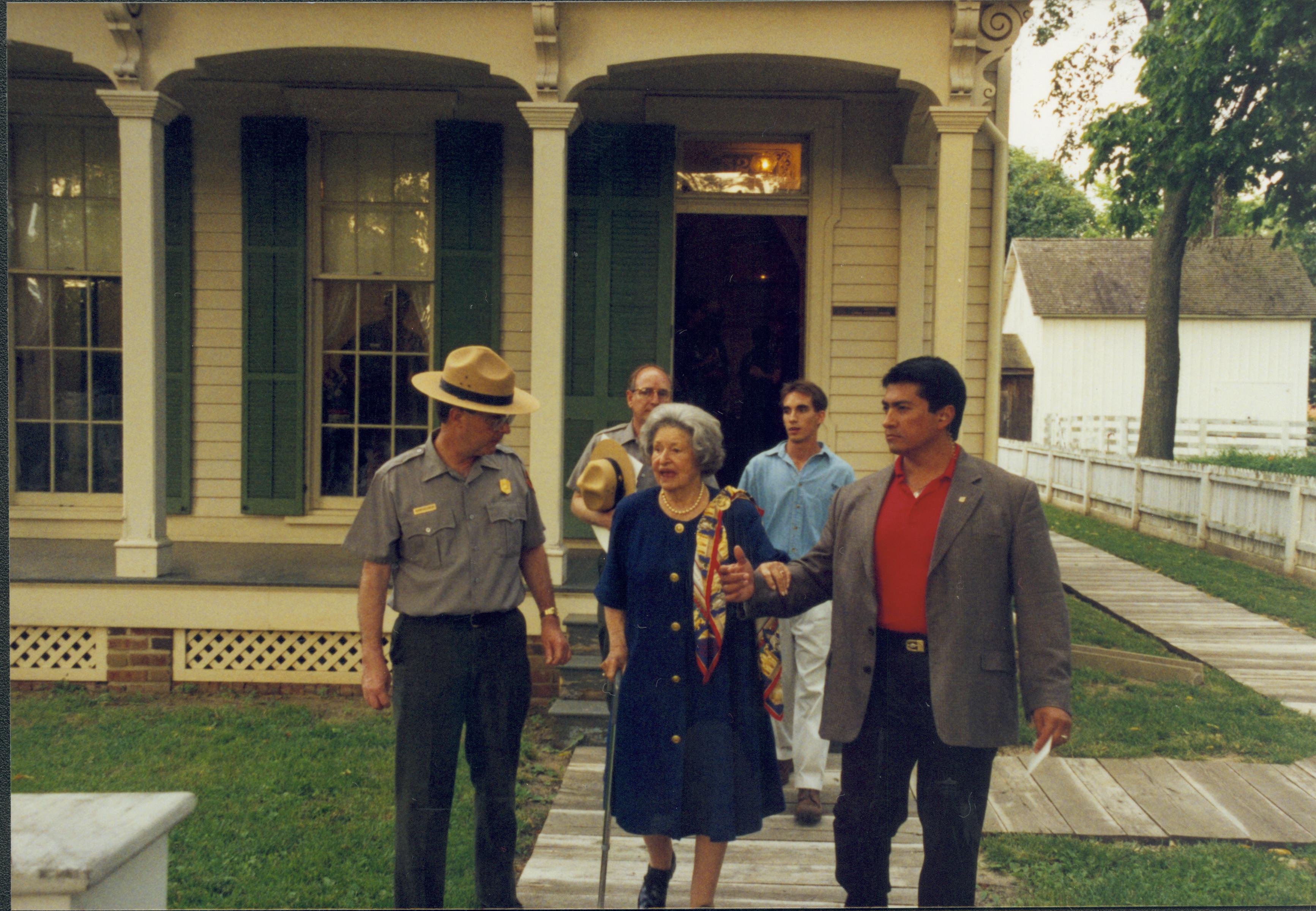 Ranger and visitors coming out of Robinson house.  Lincoln Home NHS- Lady Bird Johnson visit, roll #2 neg #6 Johnson, visit, tour