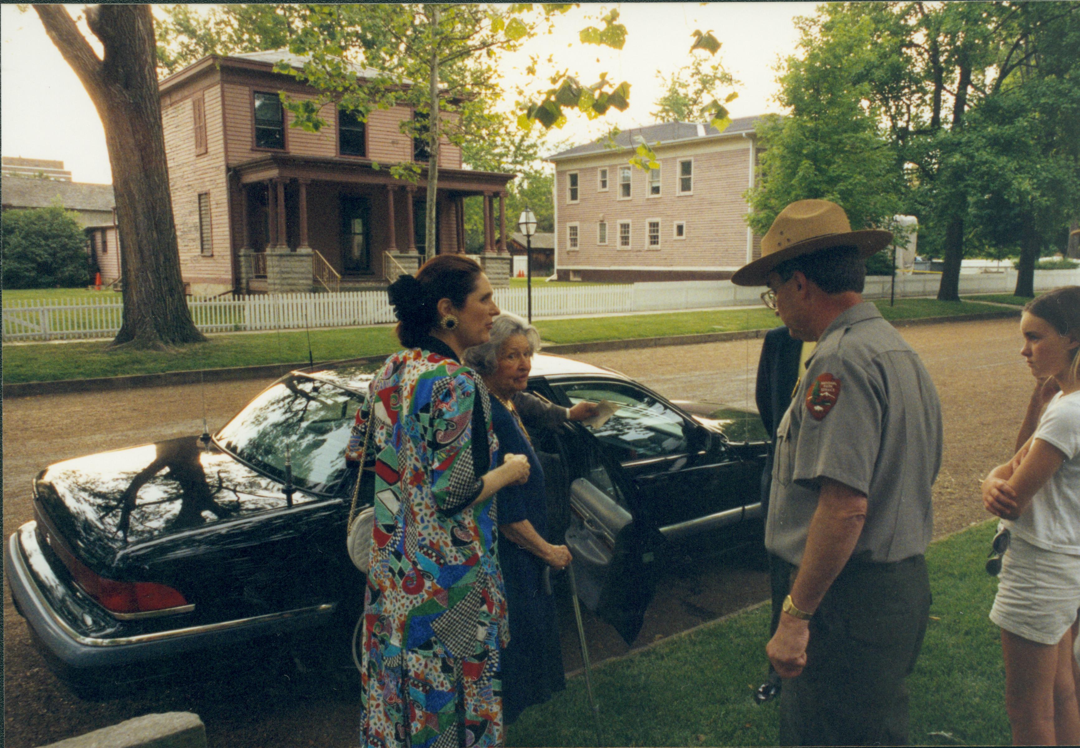 People standing by car talking. Lincoln Home NHS- Lady Bird Johnson visit, roll #2 neg #8 Johnson, visit, tour