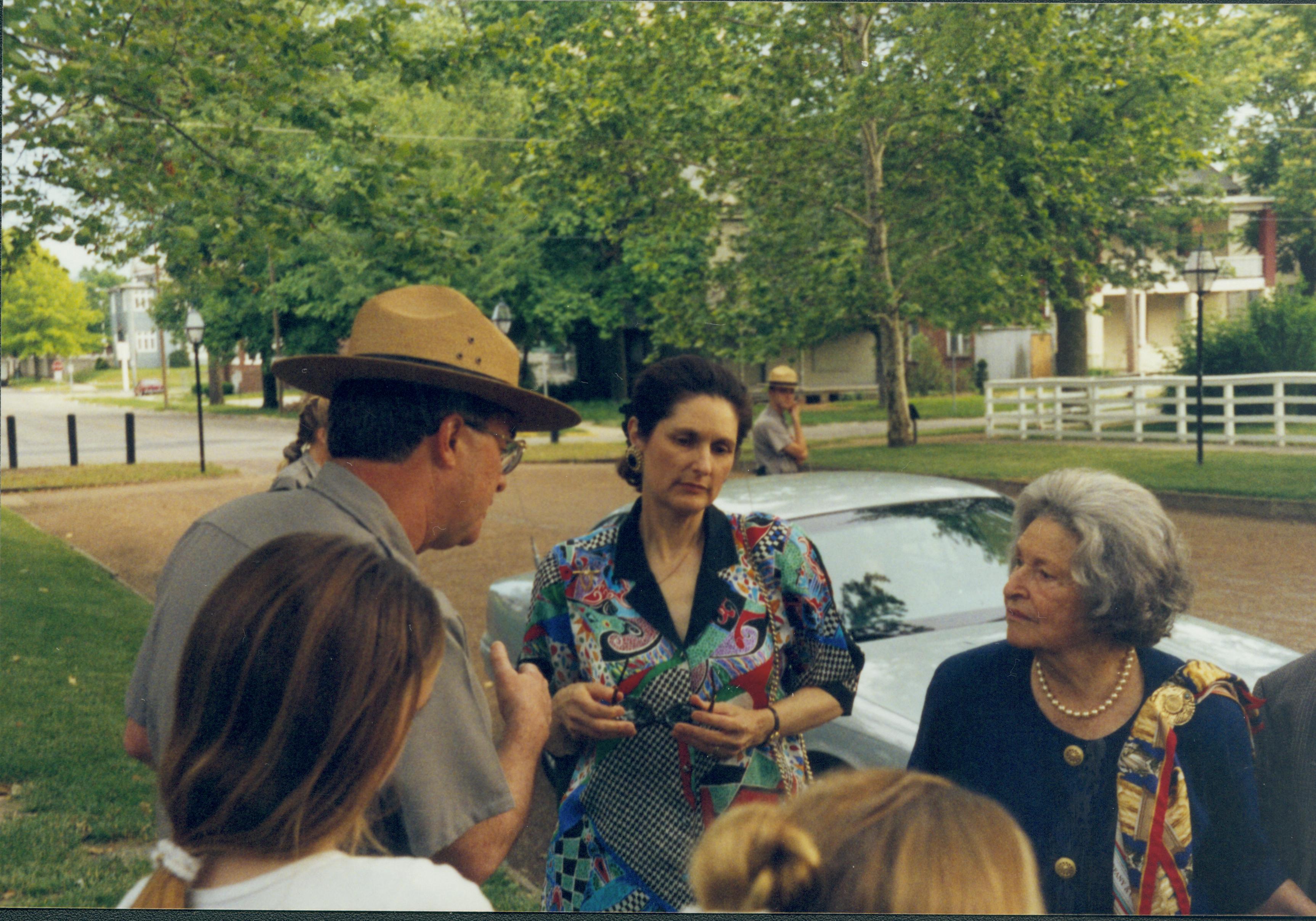 People standing by car talking. Lincoln Home NHS- Lady Bird Johnson visit, roll #2 neg #9 Johnson, visit, tour