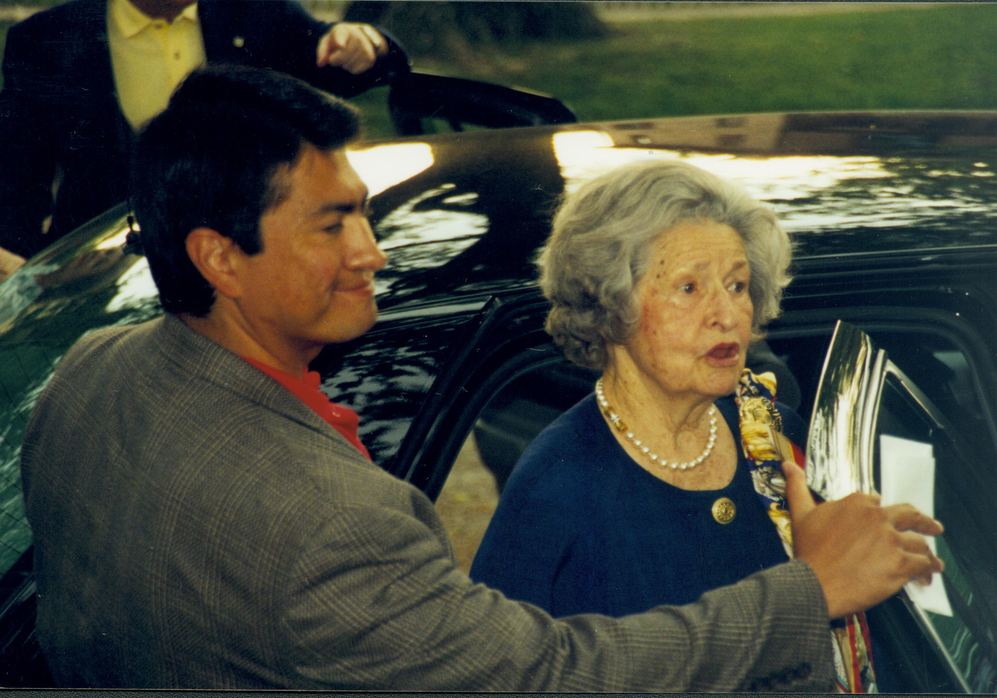 Man assisting lady into car. Lincoln Home NHS- Lady Bird Johnson visit, roll #2 neg #11 Johnson, visit, tour