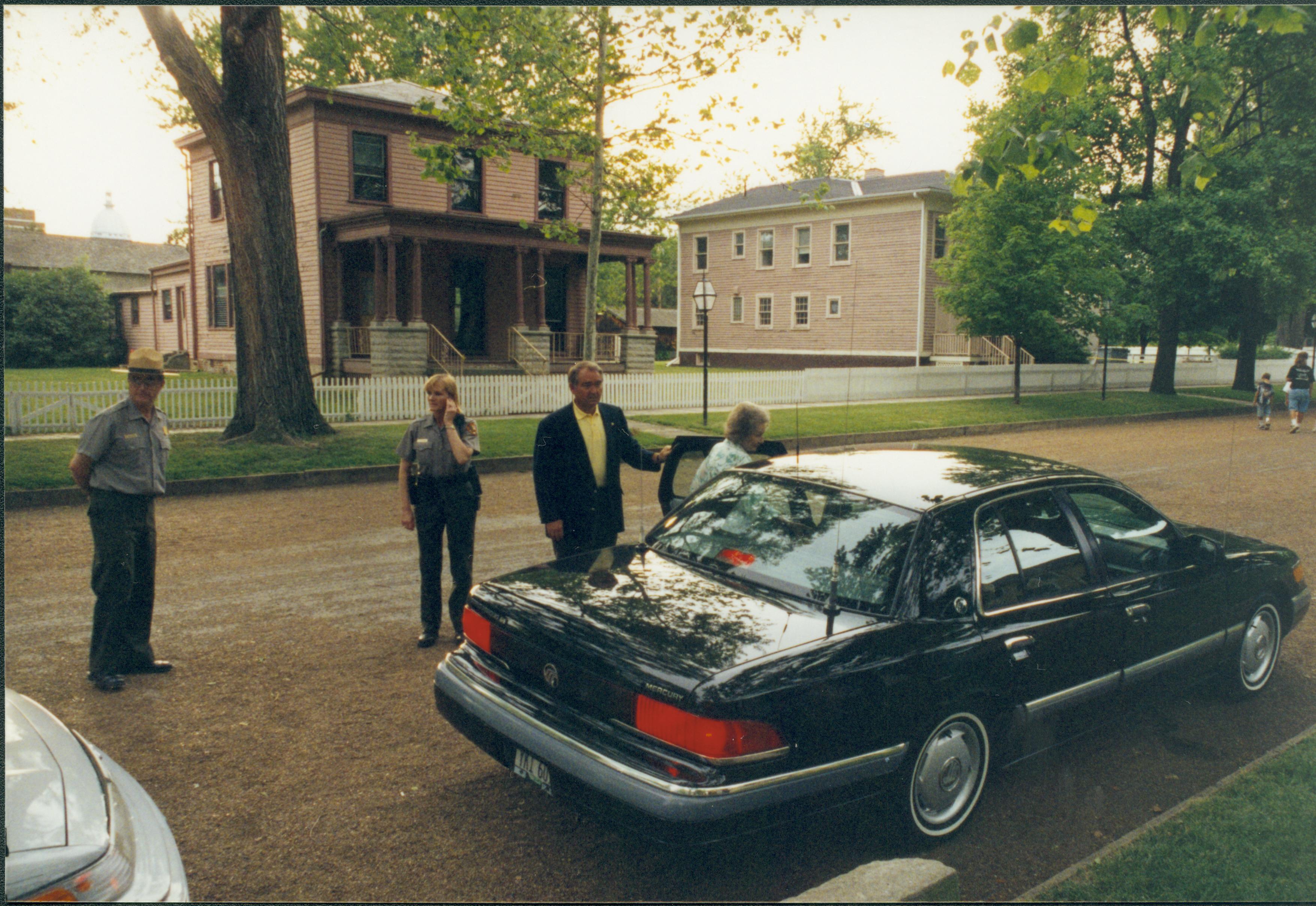 Lady getting into car. Lincoln Home NHS- Lady Bird Johnson visit, roll #2 neg #15 Johnson, visit, tour