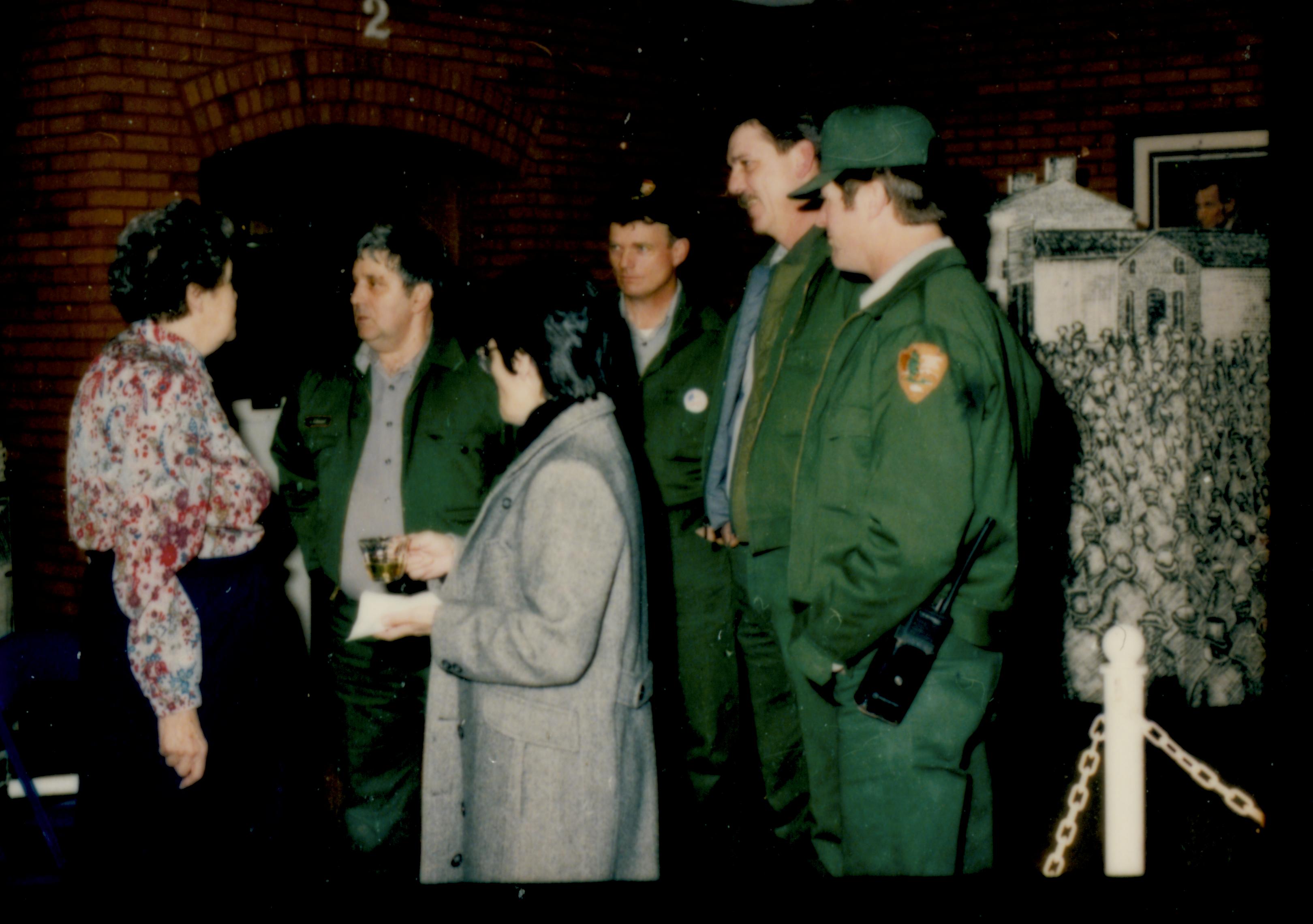 Group of people talking with lady. Lincoln Home NHS- Author Ruth Ketchum visit, 11 Ketchum, visit