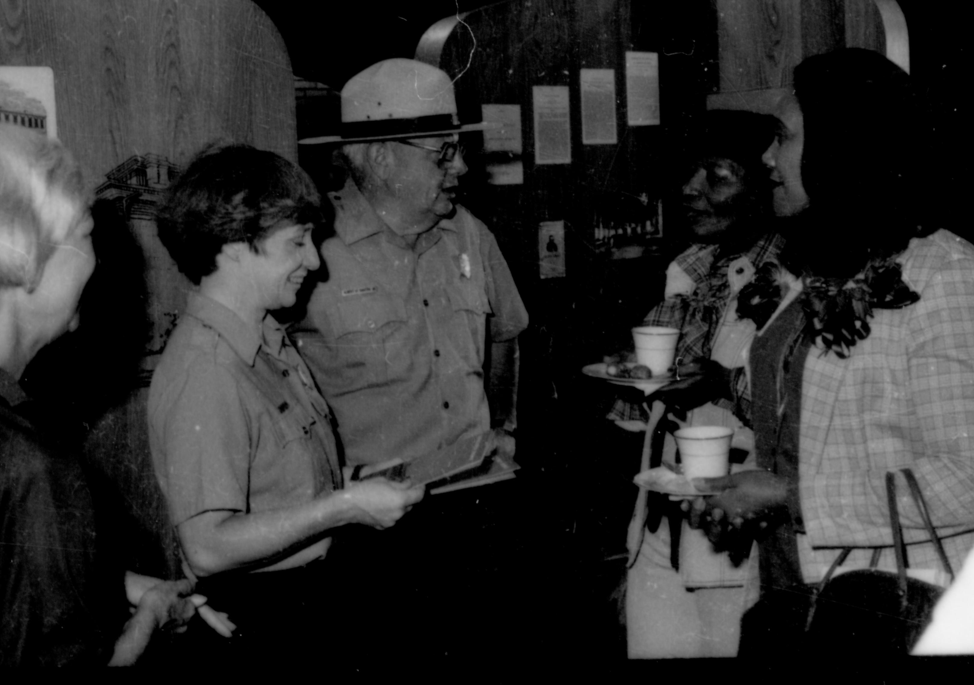 Two Rangers talking with ladies holding refreshments. Lincoln Home NHS- Coretta King Visit King, visit, reception