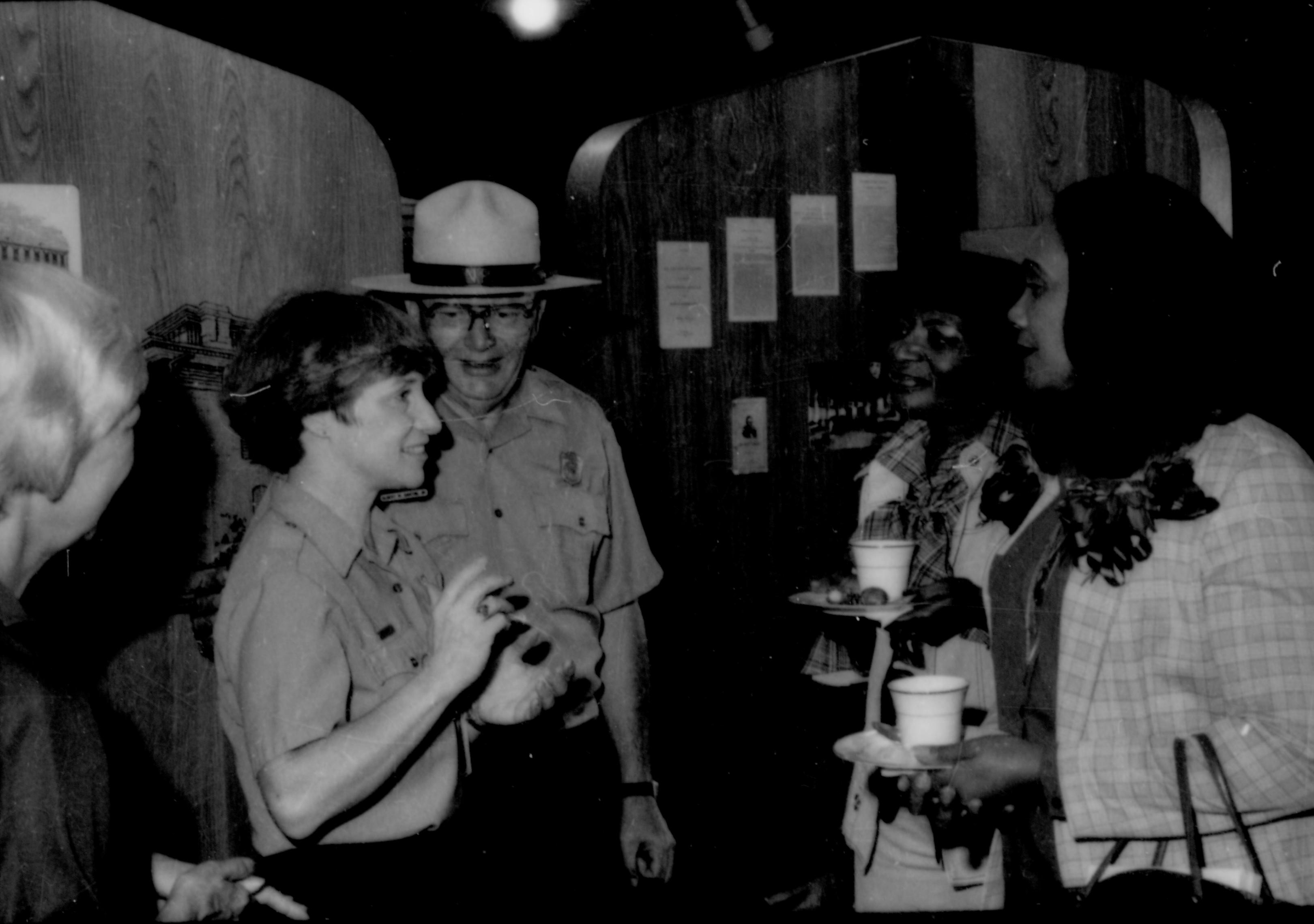 Two Rangers talking with ladies holding refreshments. Lincoln Home NHS- Coretta King Visit King, visit, reception