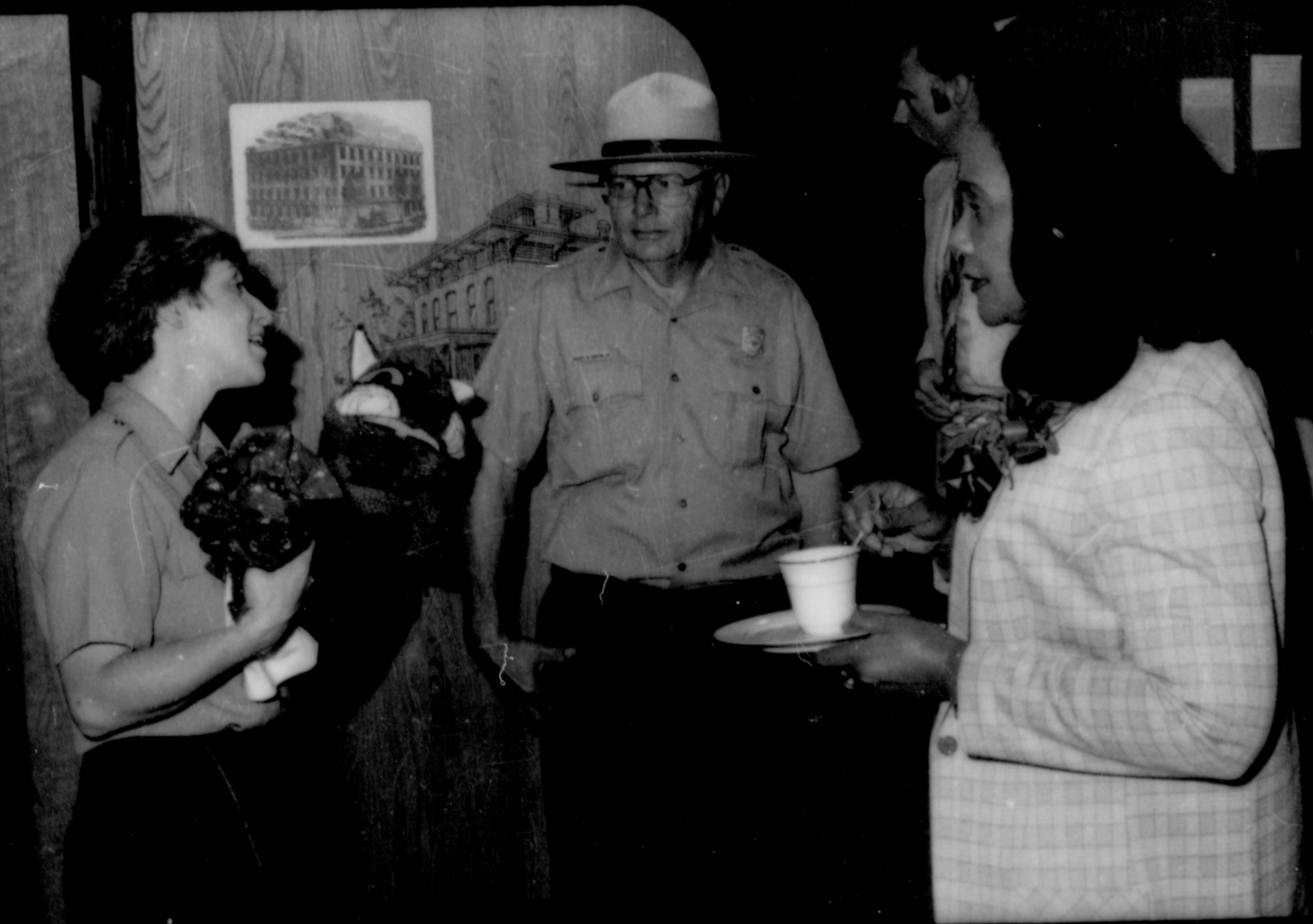 Rangers talking with lady holding refreshments. Lincoln Home NHS- Coretta King Visit King, visit, reception