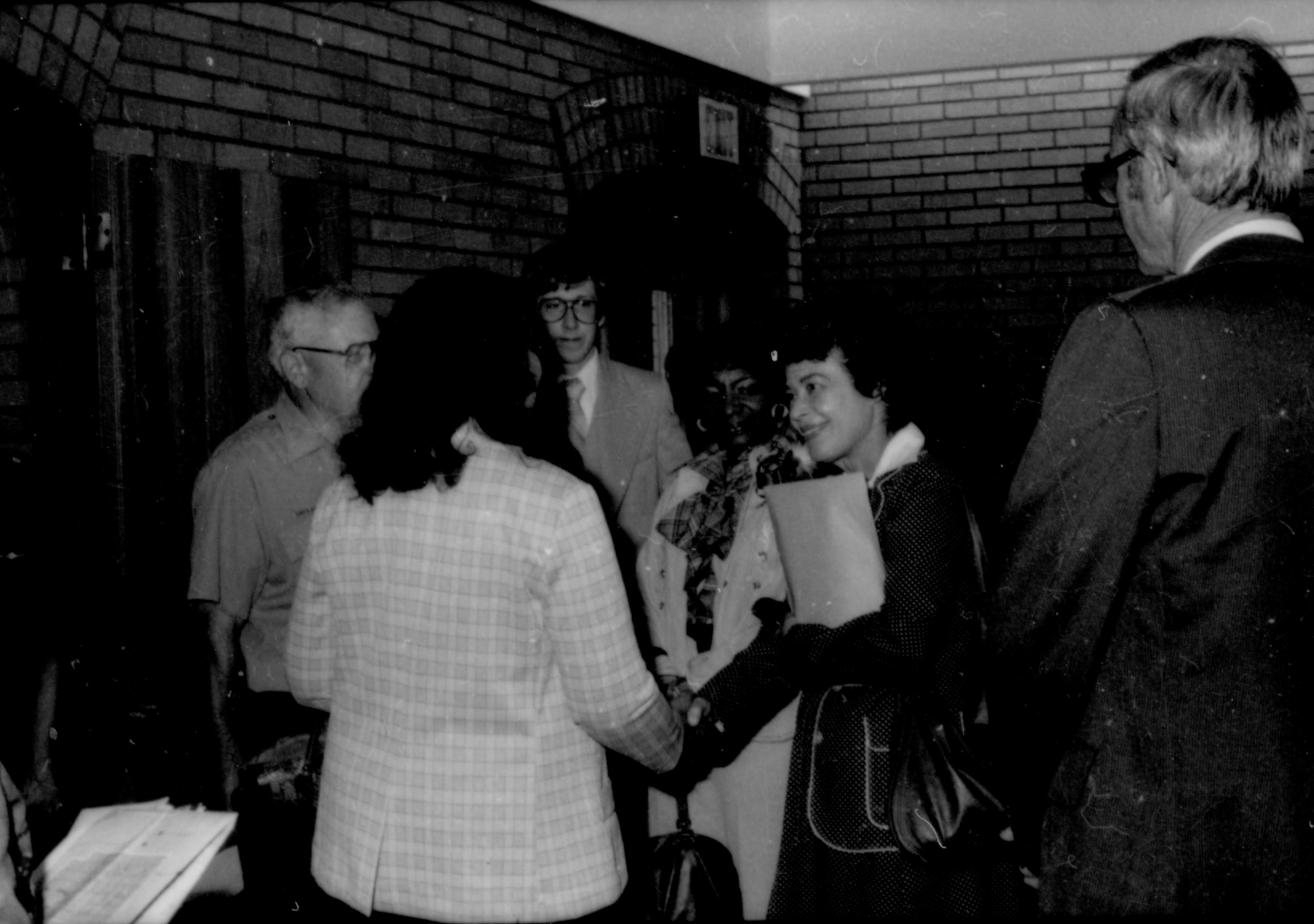 Two ladies shaking hands in VC Lincoln Home NHS- Coretta King Visit King, visit