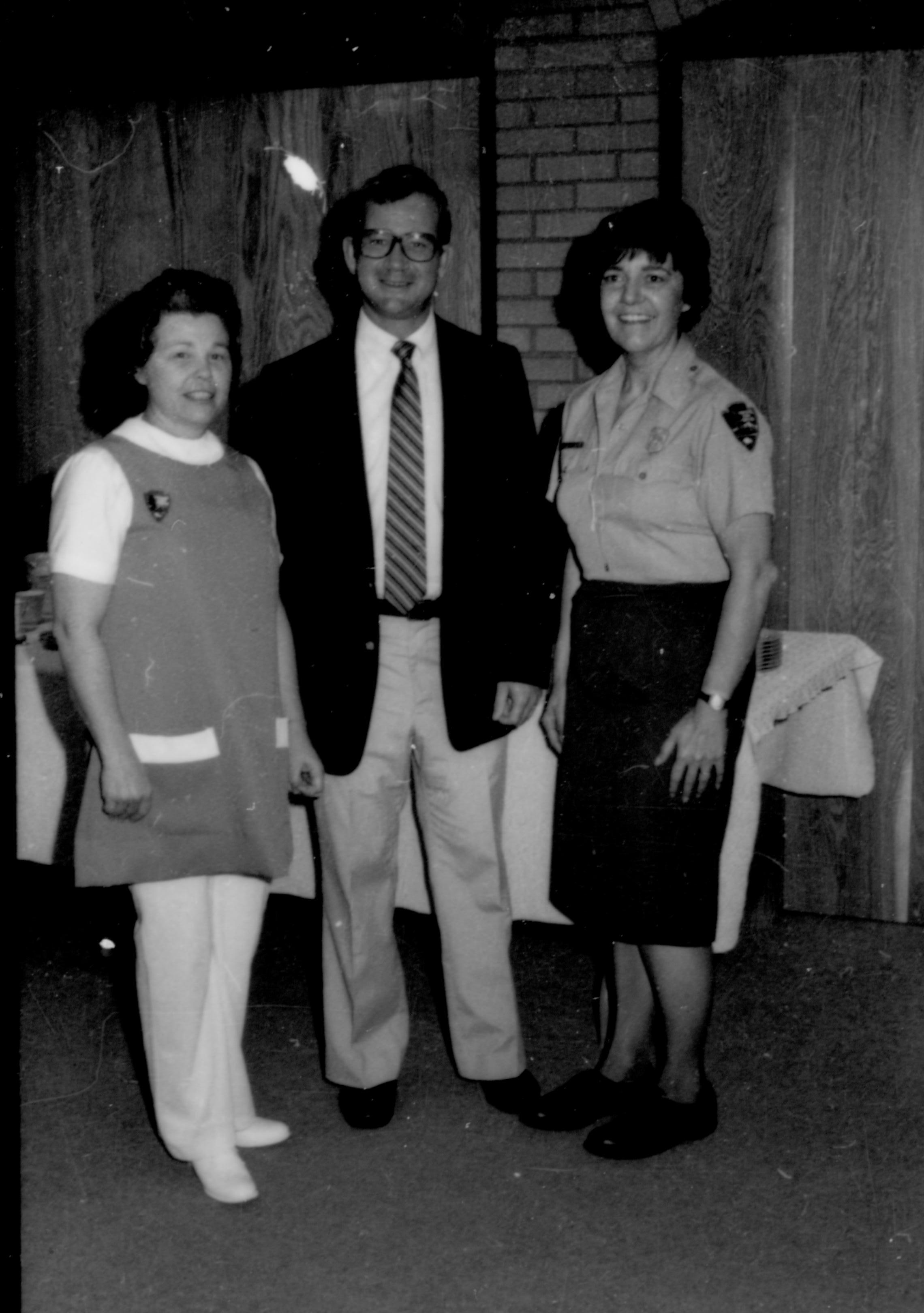 Man with two ladies on either side posing for picture. Lincoln Home NHS- Coretta King Visit King, visit