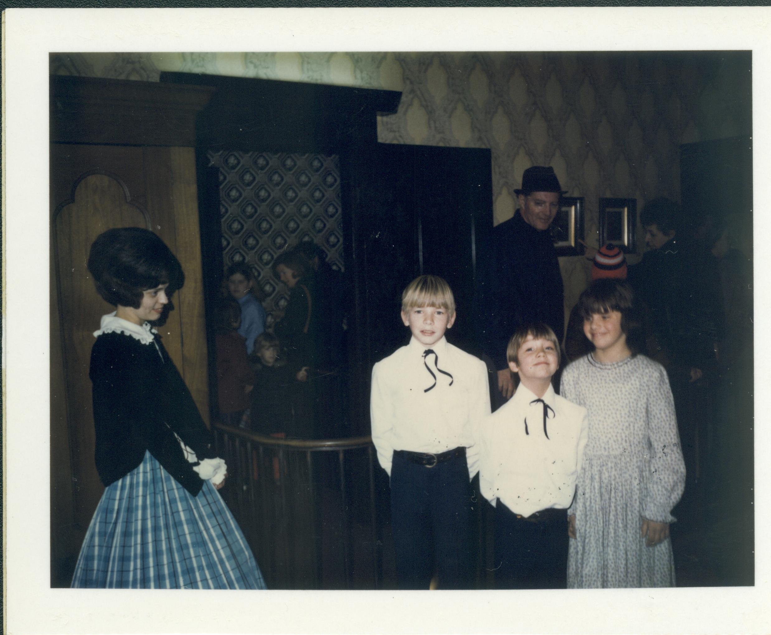 Lady and three children in period dress. Lincoln Home NHS- Lincoln's Birthday, neg 28 class 372, class 8 pic 28 birthday, Lincoln, home