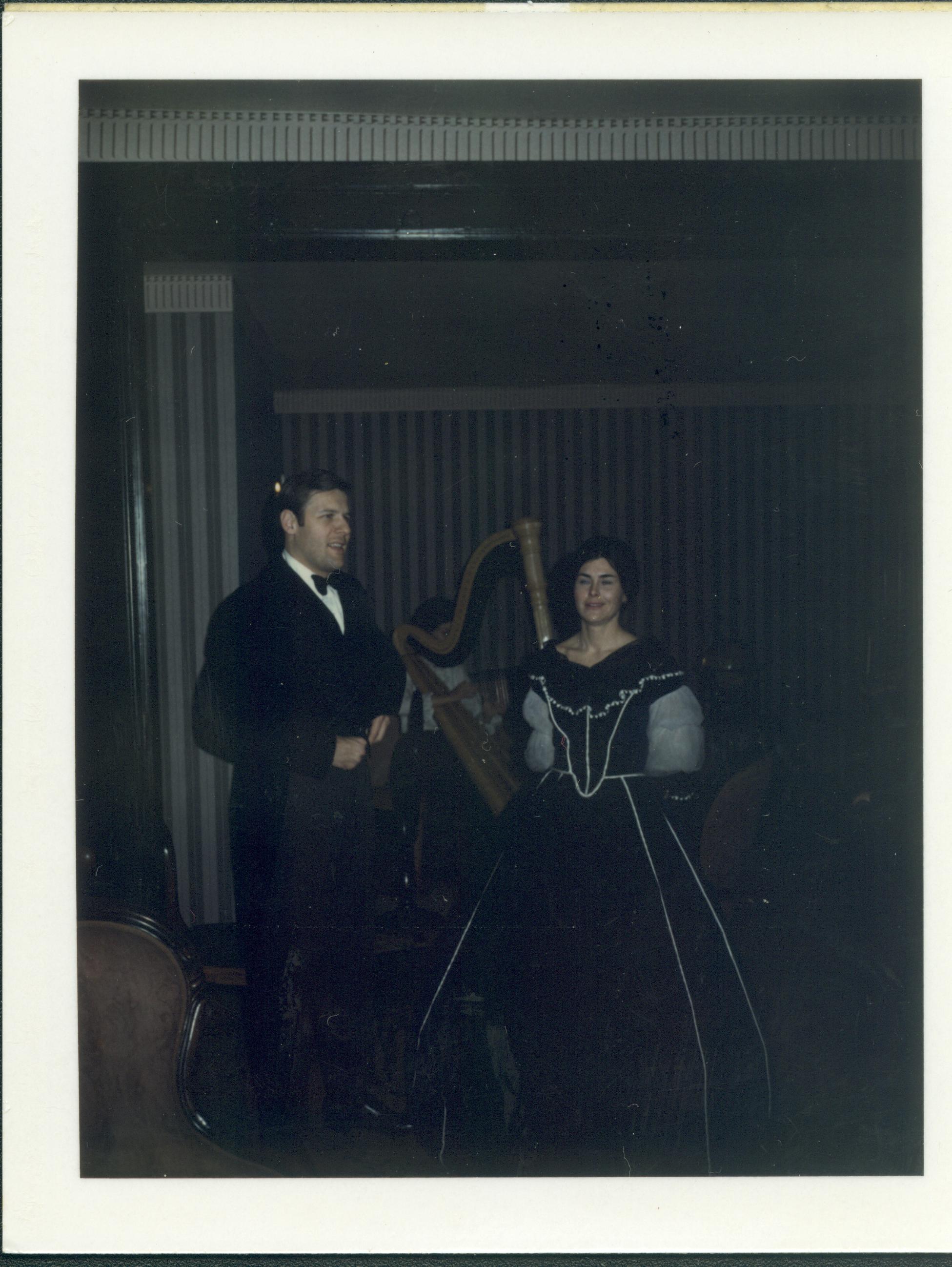 Man and woman in period dress in parlors. Lincoln Home NHS- Lincoln's Birthday, neg 30 class 372, class 8 pic 30 birthday, Lincoln, home