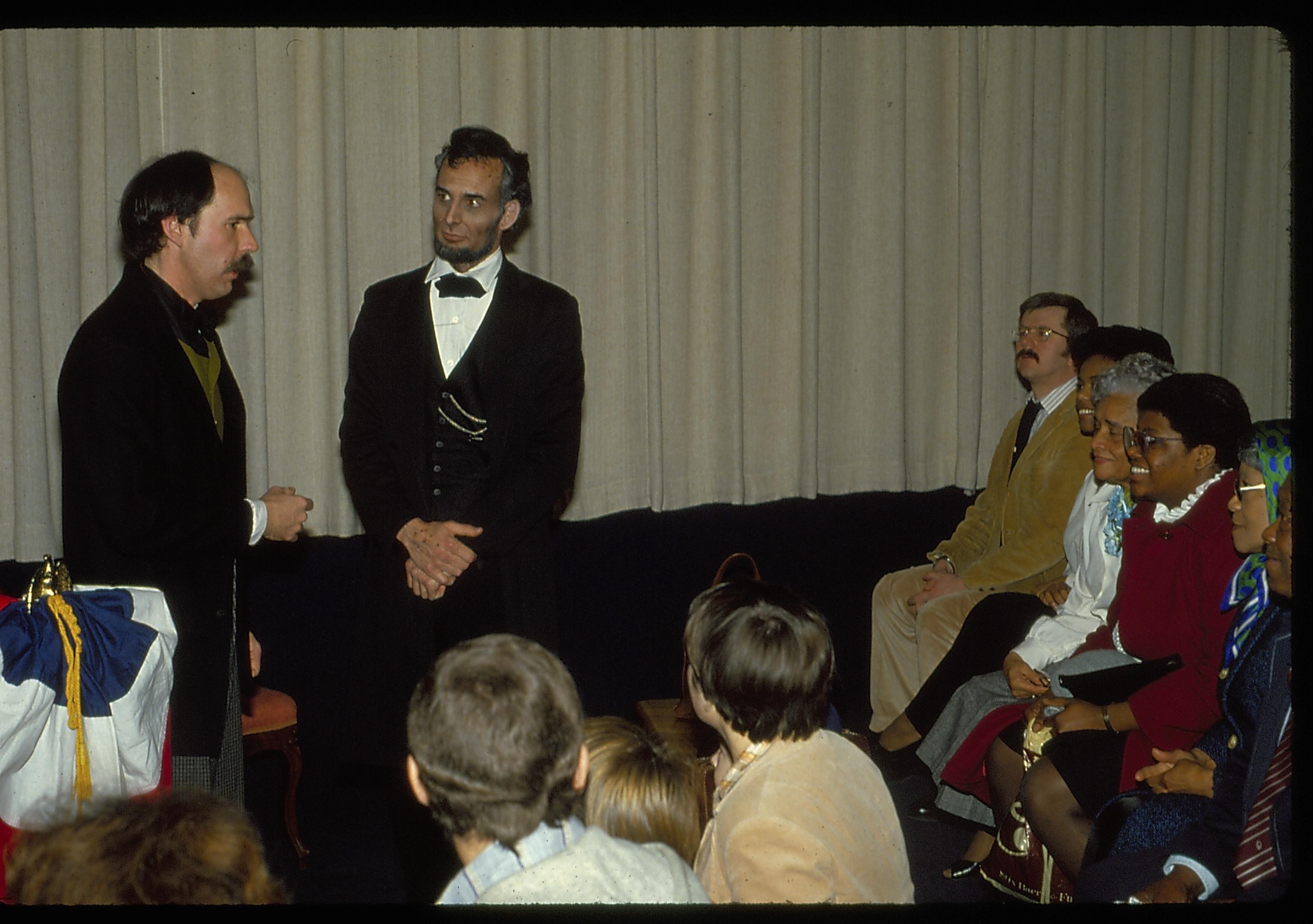 Two men in period dress in front of audience. Lincoln Home NHS- Lincoln's Birthday birthday, Lincoln, play