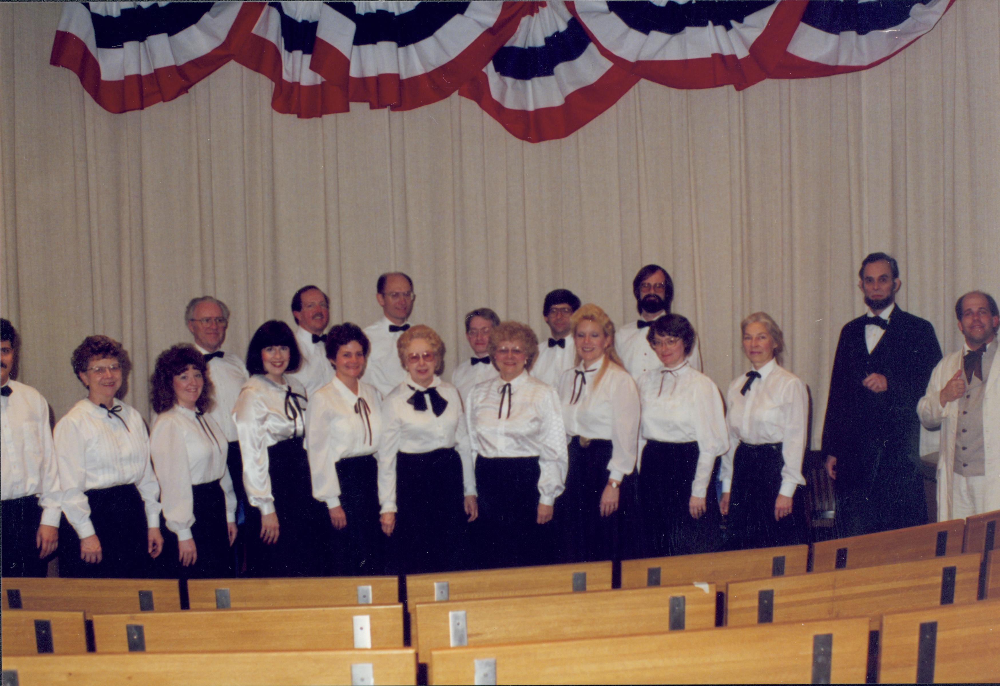 Choir standing in front of curtain with impersonators. Lincoln Home NHS- Lincoln's Birthday 1988 birthday, Lincoln, Douglas