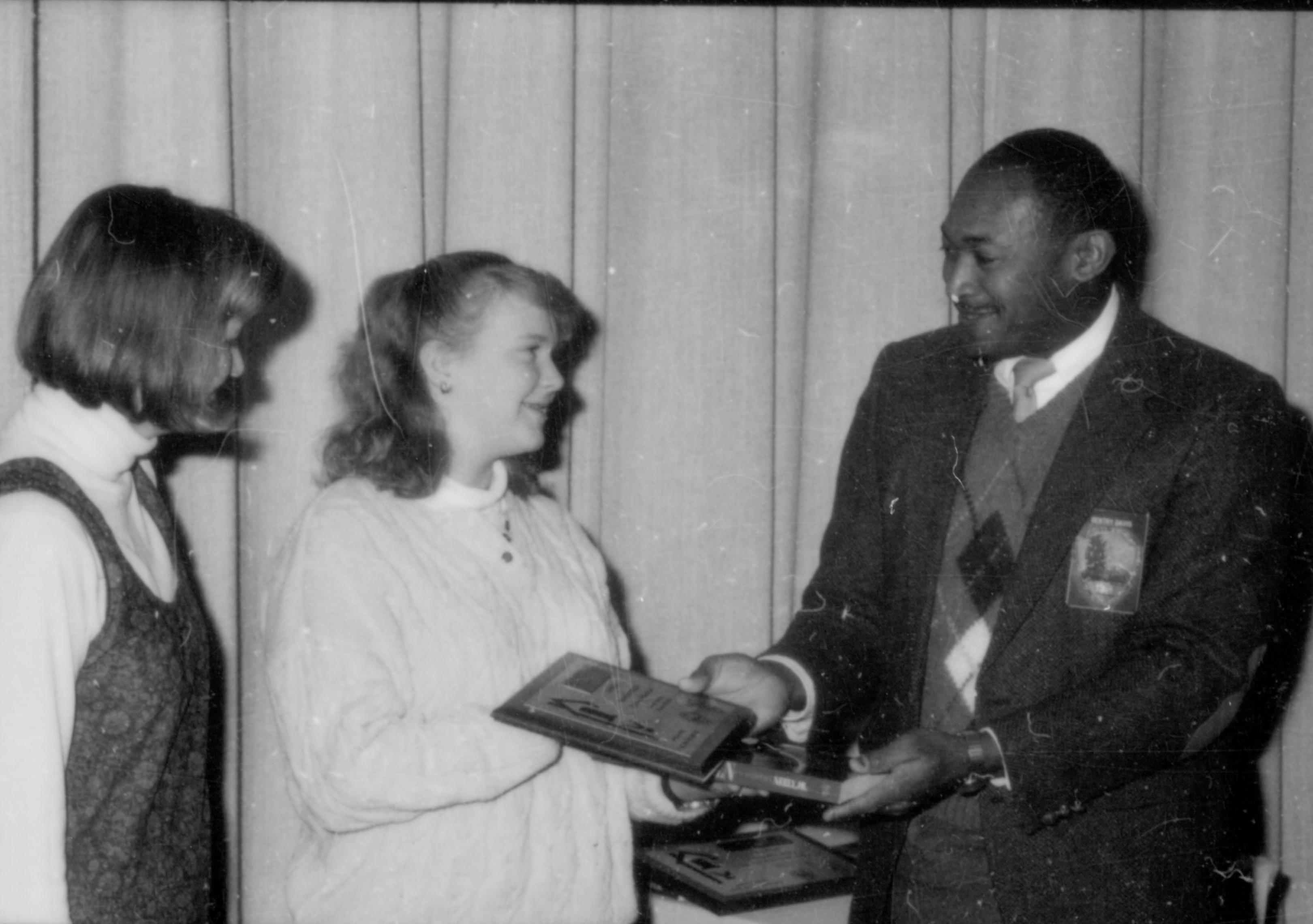 Awards being presented to two young girls. Lincoln Home NHS- Lincoln's Birthday 1988, 26 birthday, Lincoln, award