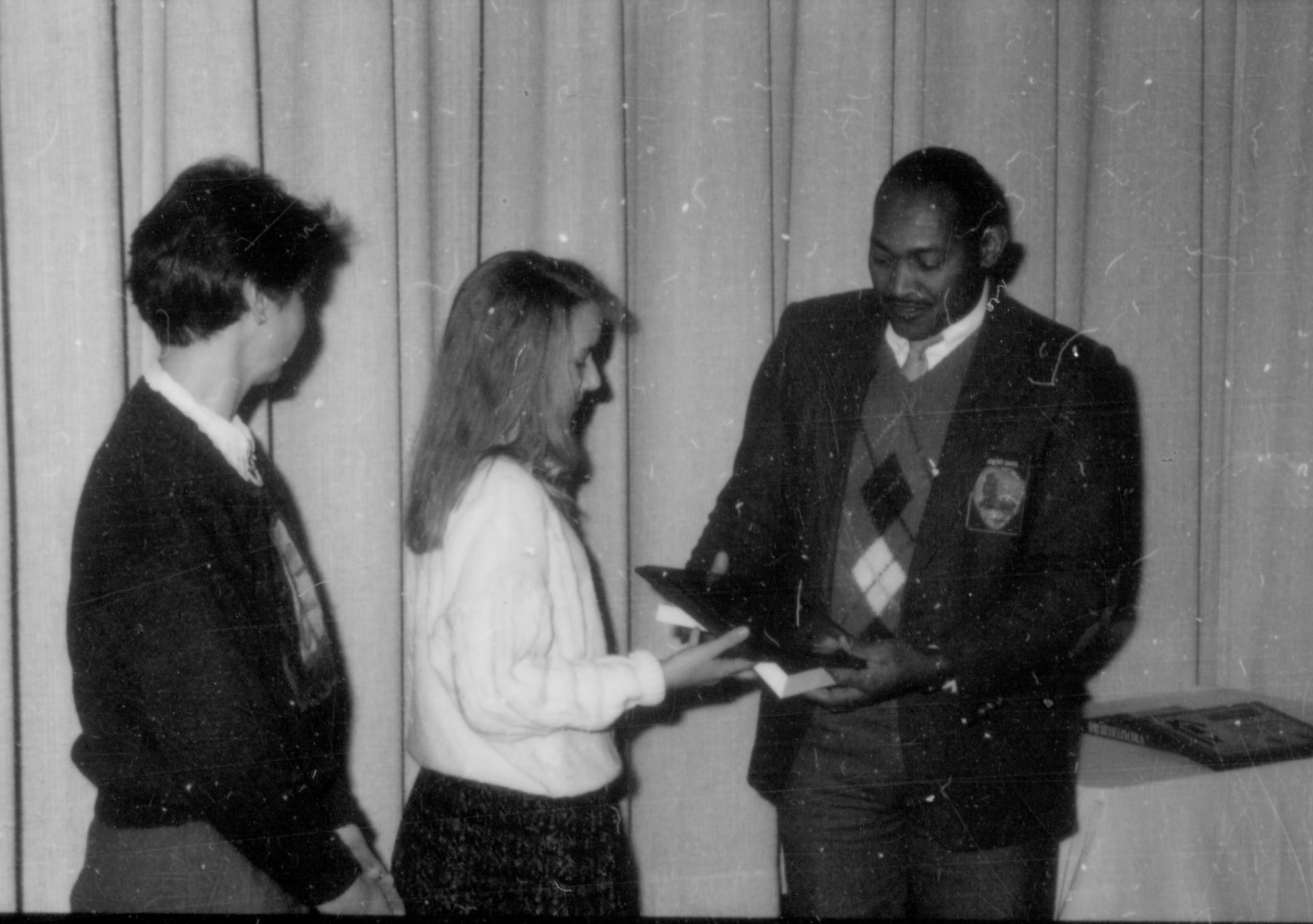 Awards being presented to two young girls. Lincoln Home NHS- Lincoln's Birthday 1988, 26 birthday, Lincoln, award