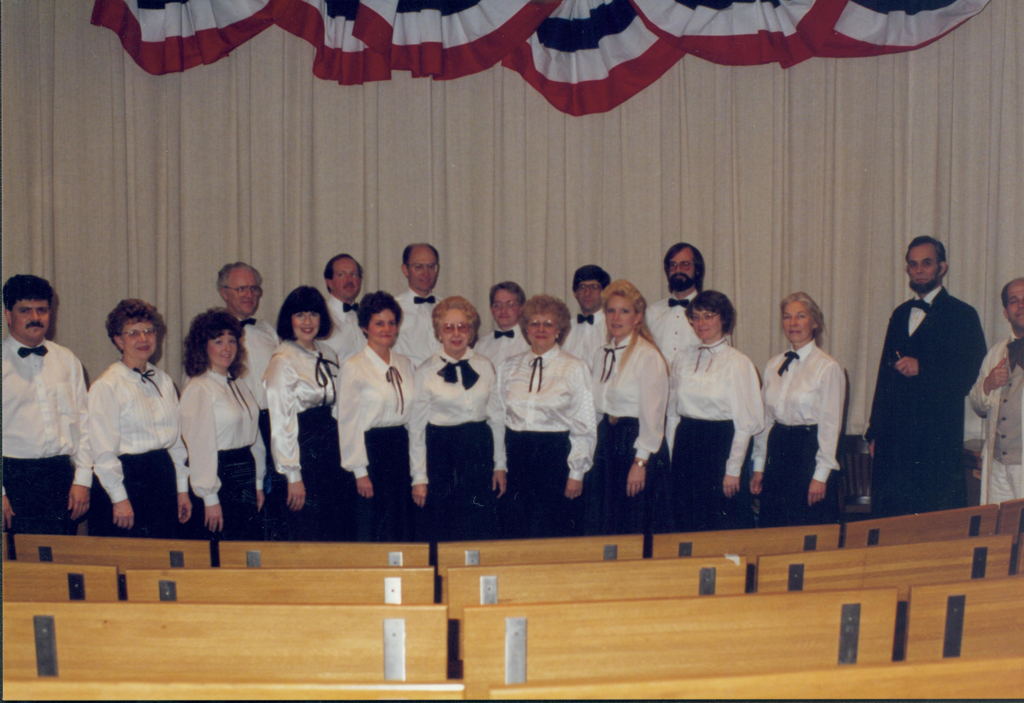 Choir standing in front of curtain with impersonators. Lincoln Home NHS- Lincoln's Birthday 1988 birthday, Lincoln, Douglas
