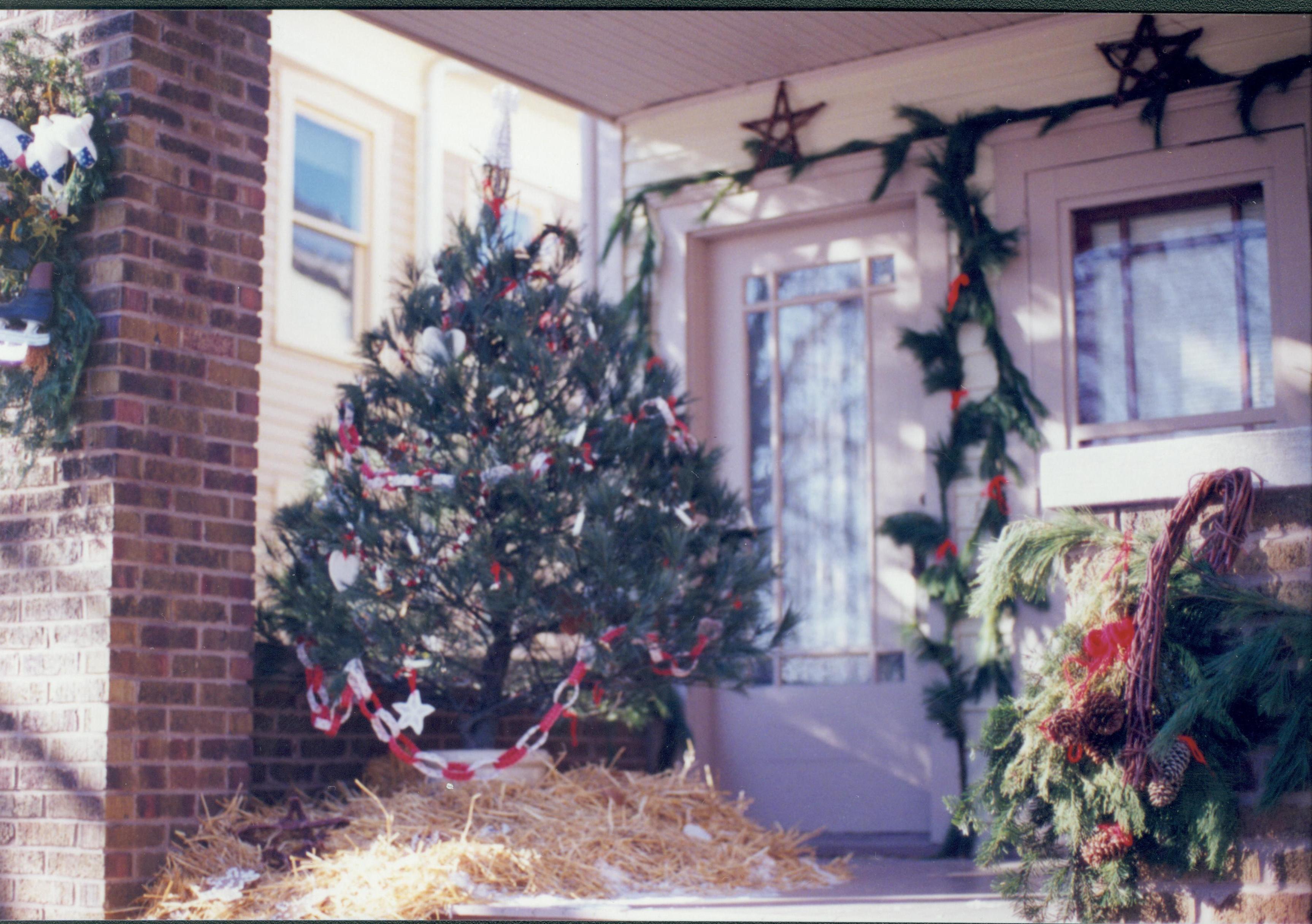 Lincoln Home NHS- Christmas in Lincoln Neighborhood Looking south west, Christmas decor on Sprigg house porch. Detail. Christmas, neighborhood, Sprigg, porch, decor, detail, wreath, garland, tree