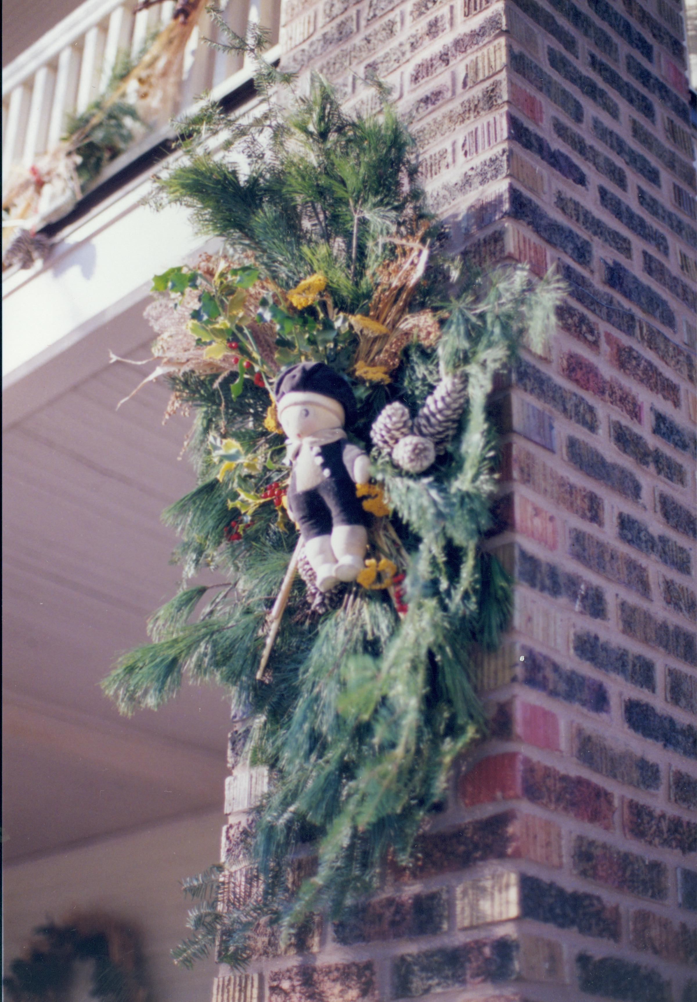 Lincoln Home NHS- Christmas in Lincoln Neighborhood Looking south west, Christmas wreath on porch column of Sprigg house. Detail. Christmas, neighborhood, column, porch, wreath, Sprigg, detail