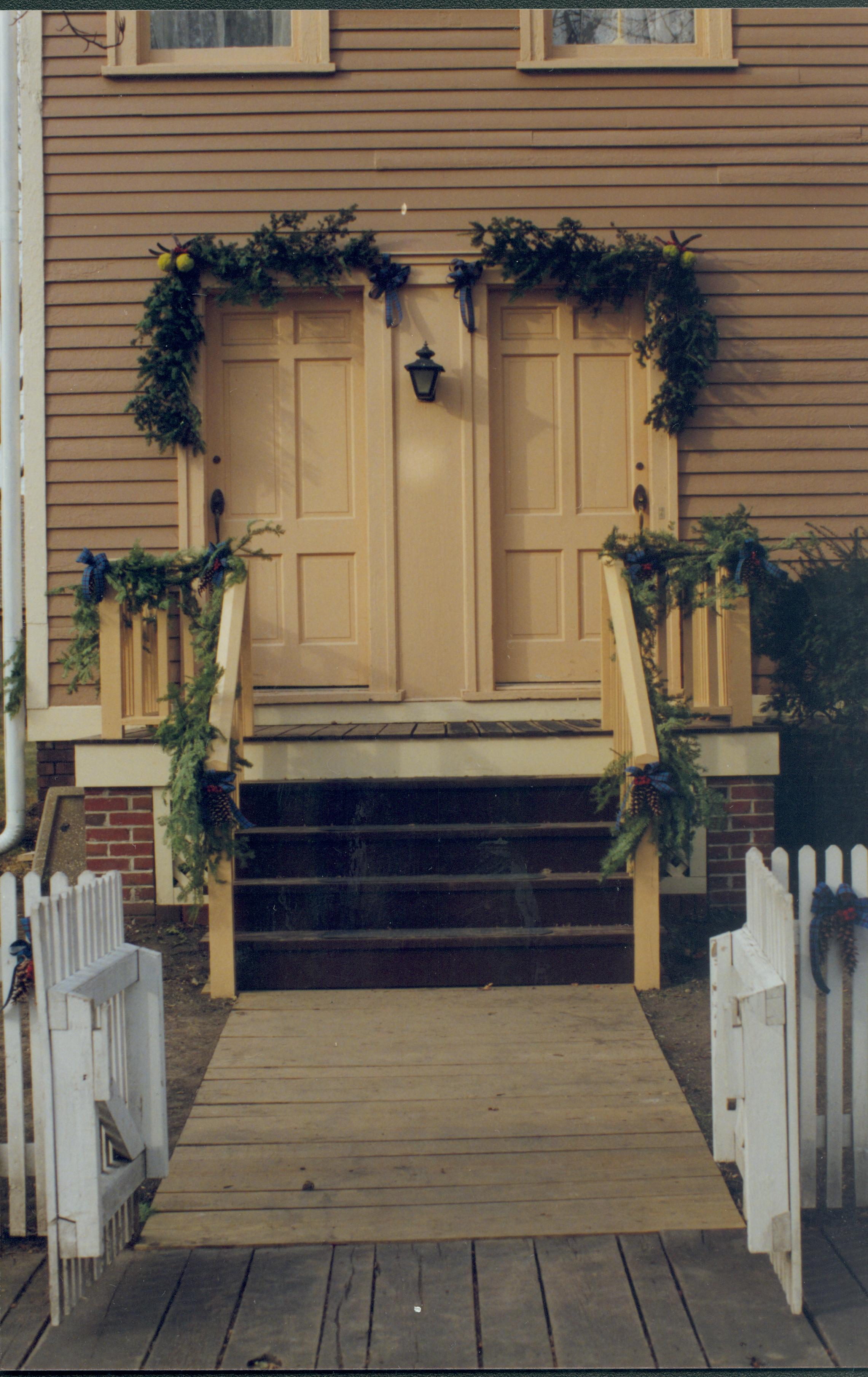 Lincoln Home NHS- Christmas in Lincoln Neighborhood Looking west, Christmas decor on Miller house porch and door. Christmas, neighborhood, door, decor, garland, Miller