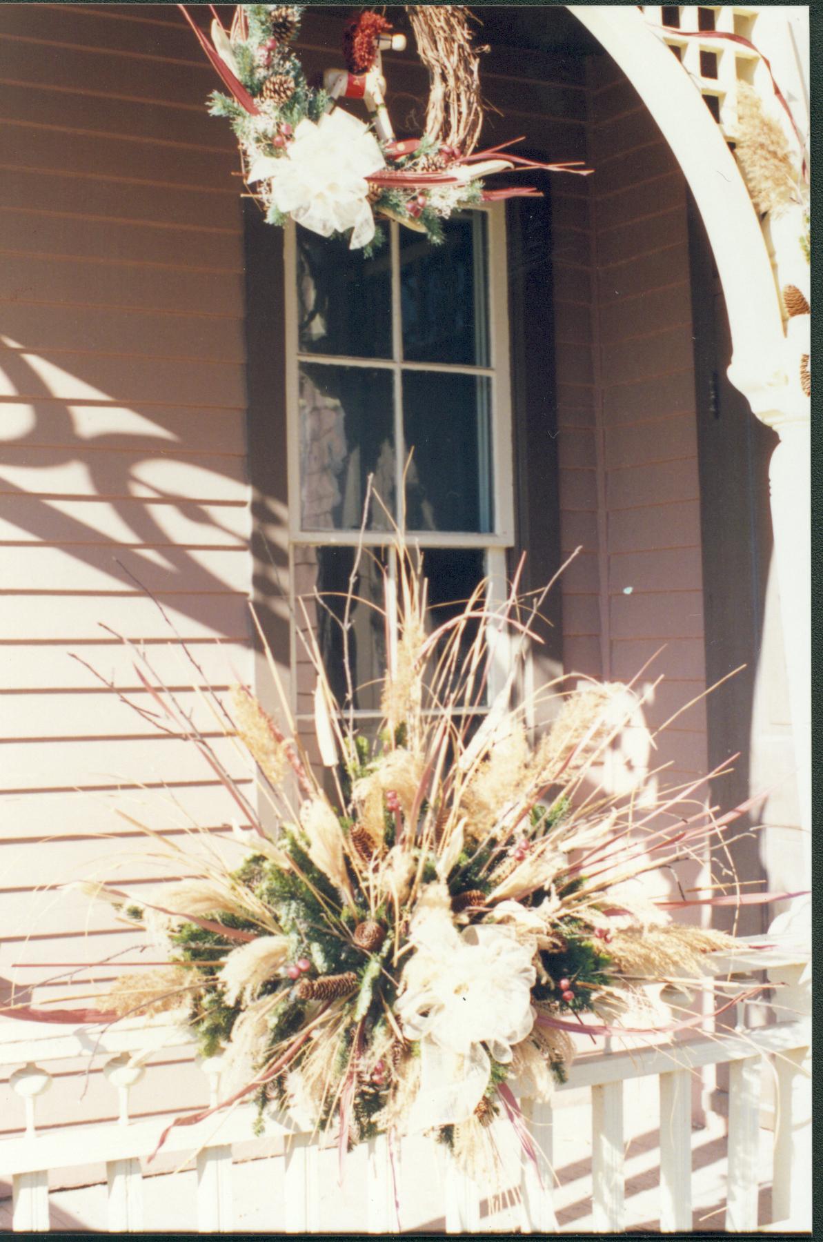 Lincoln Home NHS- Christmas in Lincoln Neighborhood Looking north west, Christmas decor on east porch rails of Dean house. Detail. Christmas, neighborhood, decor, wreath, detail, porch, Dean