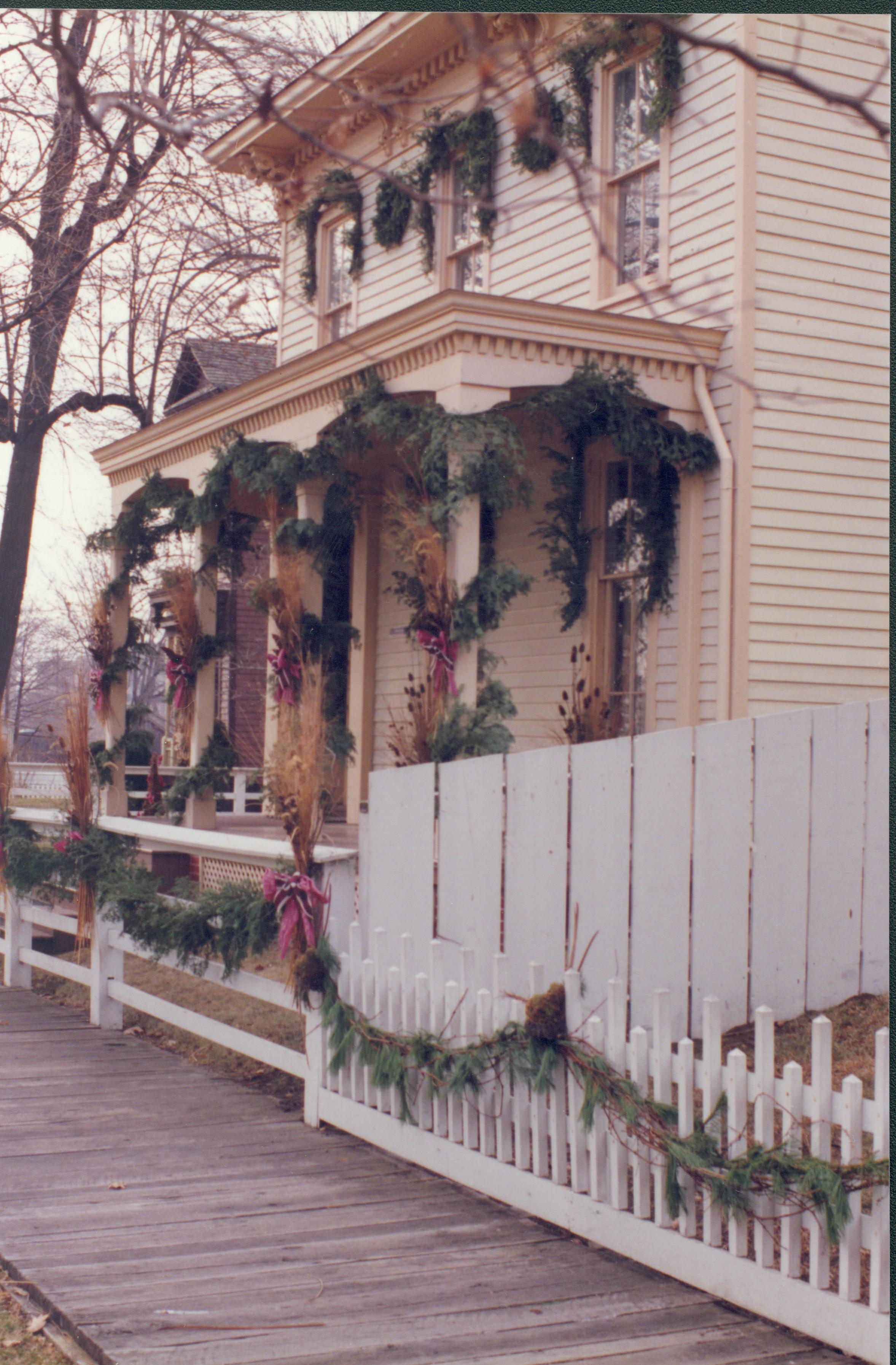 Lincoln Home NHS- Christmas in Lincoln Neighborhood Looking south west from boardwalk, Christmas decor on Rosenwald house. Christmas, neighborhood, decor, wreath, garland, Rosenwald, Lyon