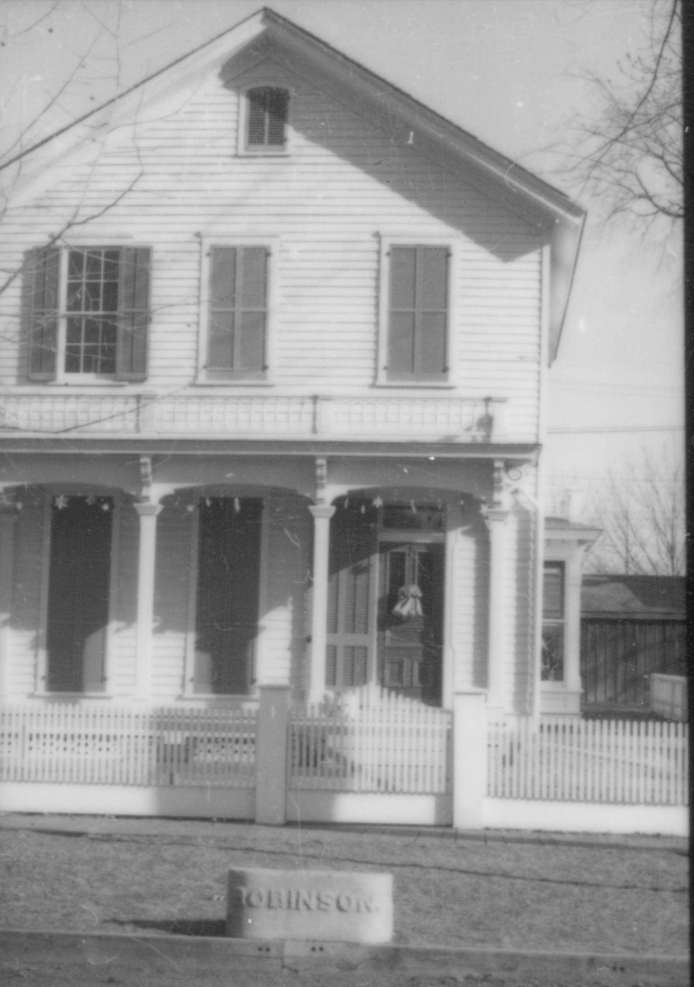 Lincoln Home NHS- Christmas in Lincoln Neighborhood Looking east from 8th Street, Christmas decor on Robinson house door and porch. Christmas, neighborhood, Robinson, decor, wreath, porch