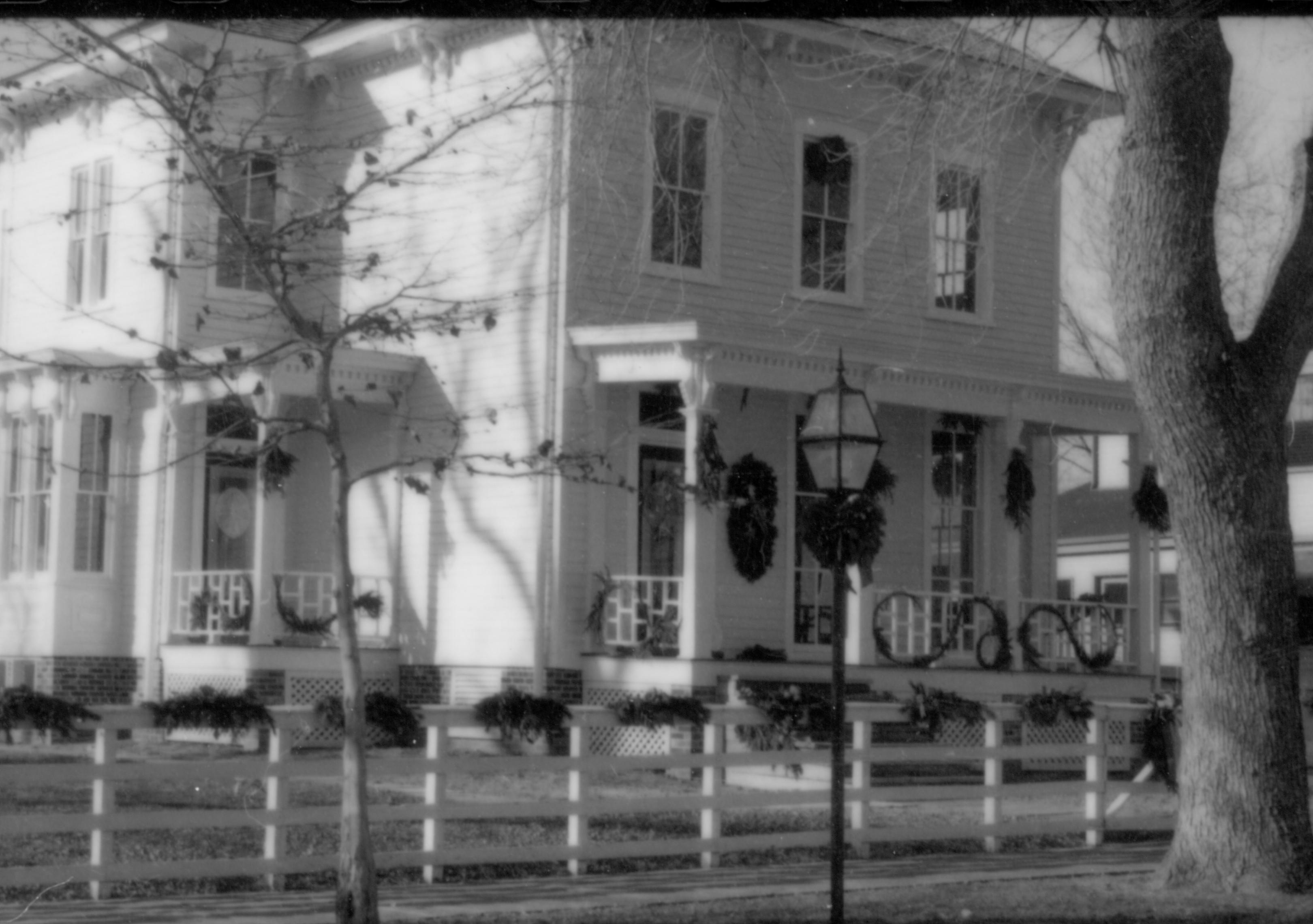 Lincoln Home NHS- Christmas in Lincoln Neighborhood Looking north west from 8th Street, Christmas decor on Shutt fence and house. Christmas, neighborhood, Shutt, fence, decor, garland, wreath