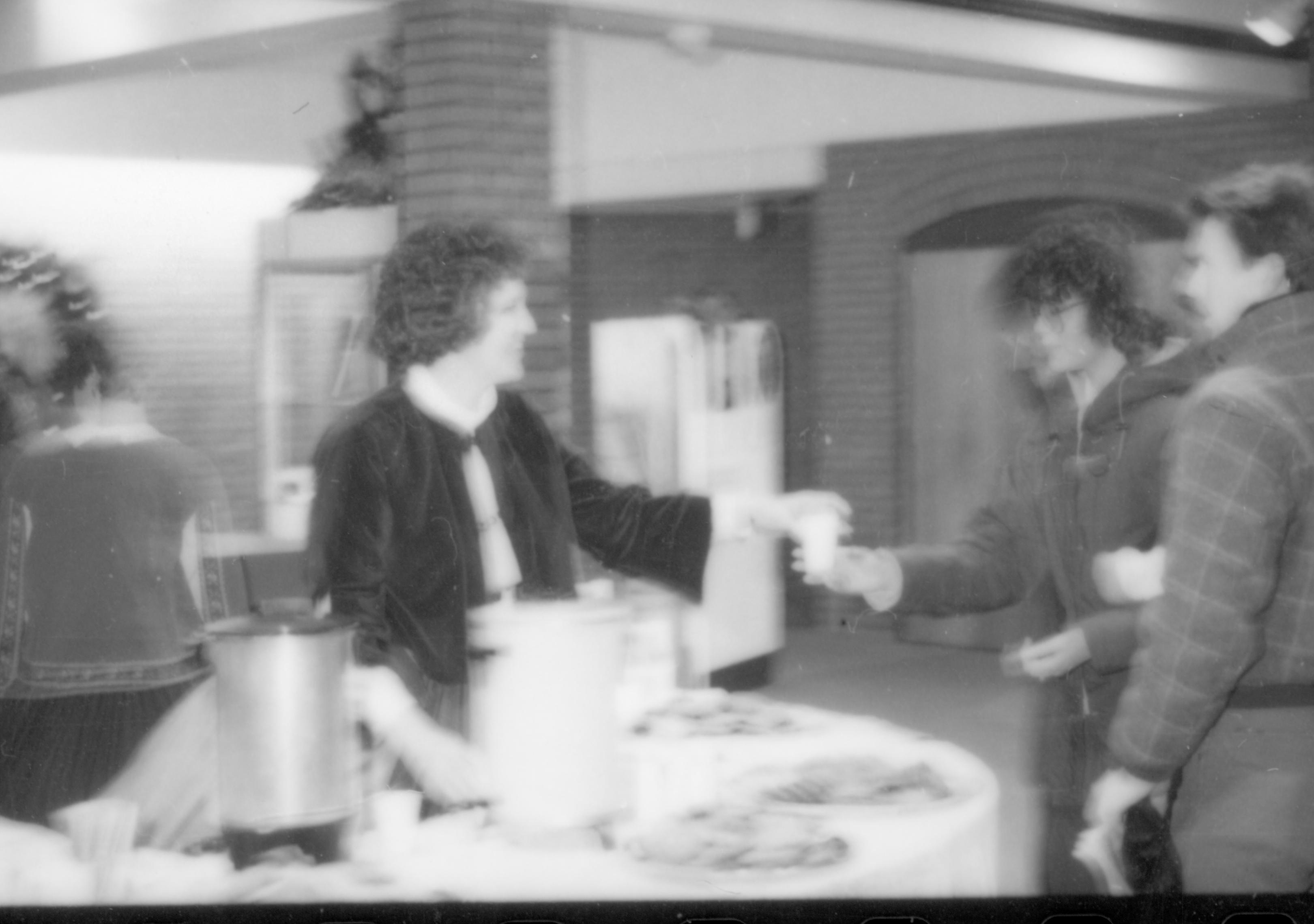 Lincoln Home NHS- Christmas in Lincoln Neighborhood Looking north west, staff in Visitor Center serving refreshments to visitors at table in lobby. Christmas, neighborhood, staff, visitor, refreshment, lobby, Visitor, Center