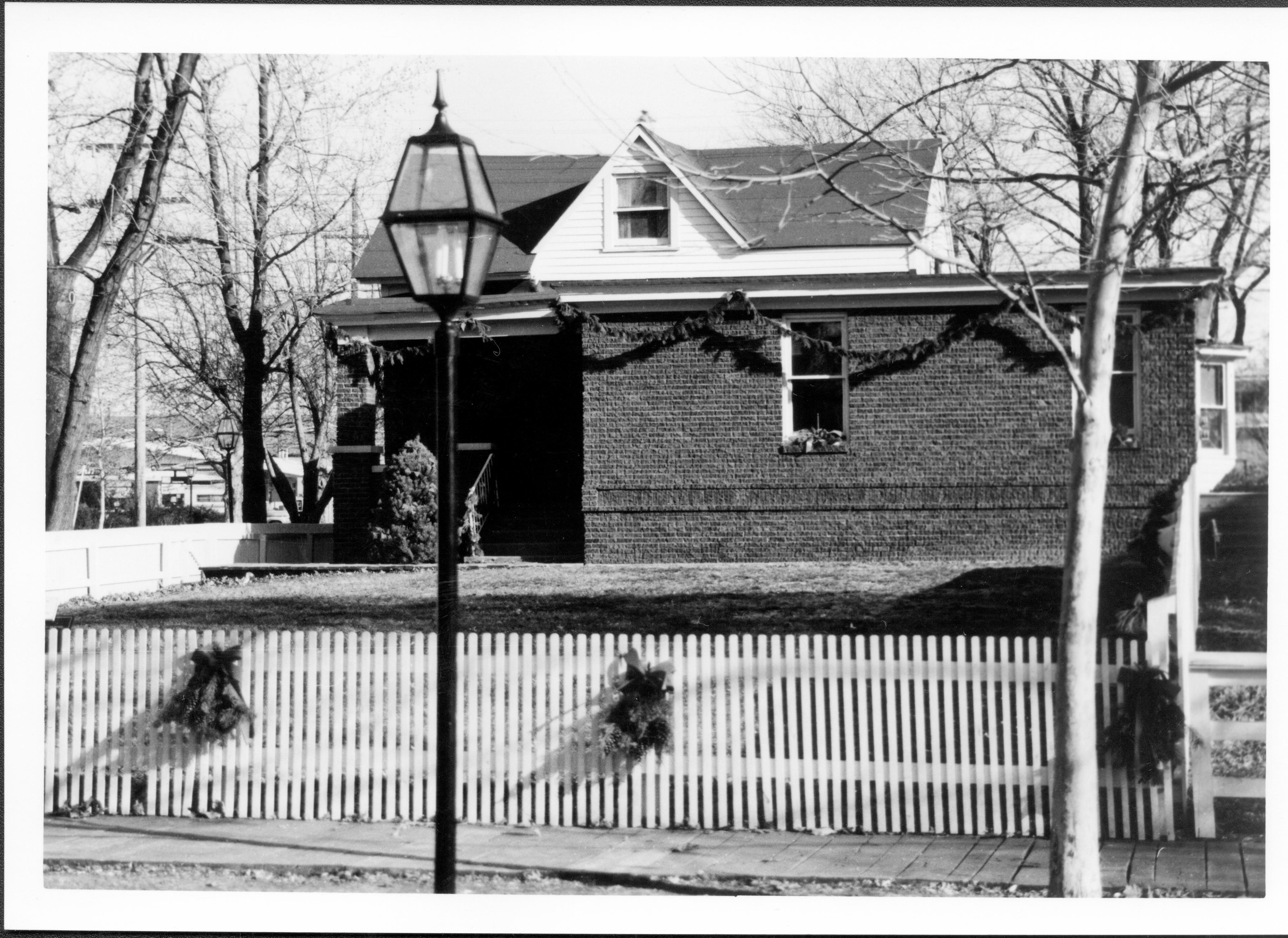 Lincoln Home NHS- Christmas in Lincoln Neighborhood Looking east from 8th Street toward Arnold house and lot. Pre-restoration. Christmas, neighborhood, Arnold, decoration