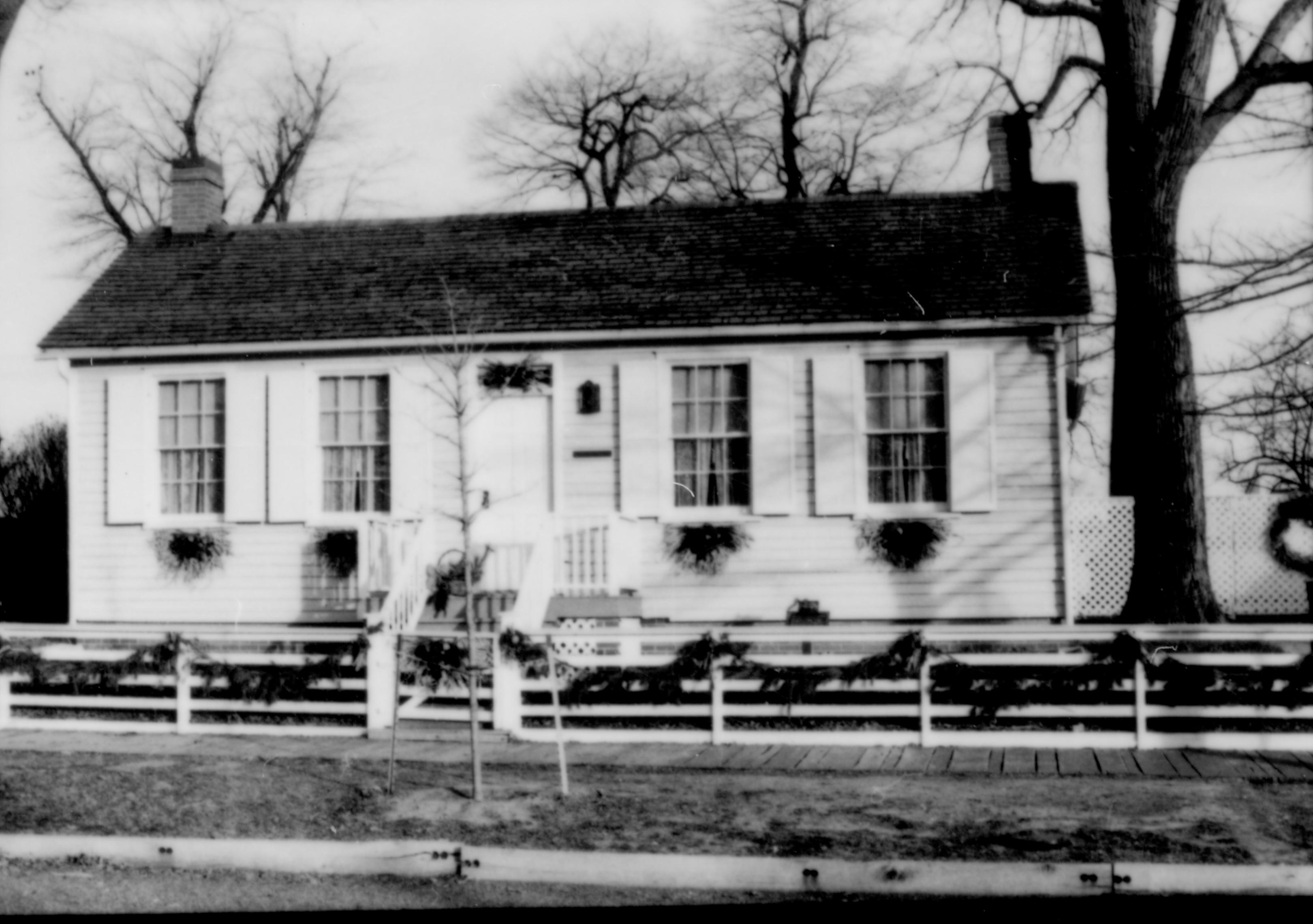 Lincoln Home NHS- Christmas in Lincoln Neighborhood Looking east, west face of Corneau house decorated for Christmas. Christmas, decorations, Corneau, house, decor, wreath, garland