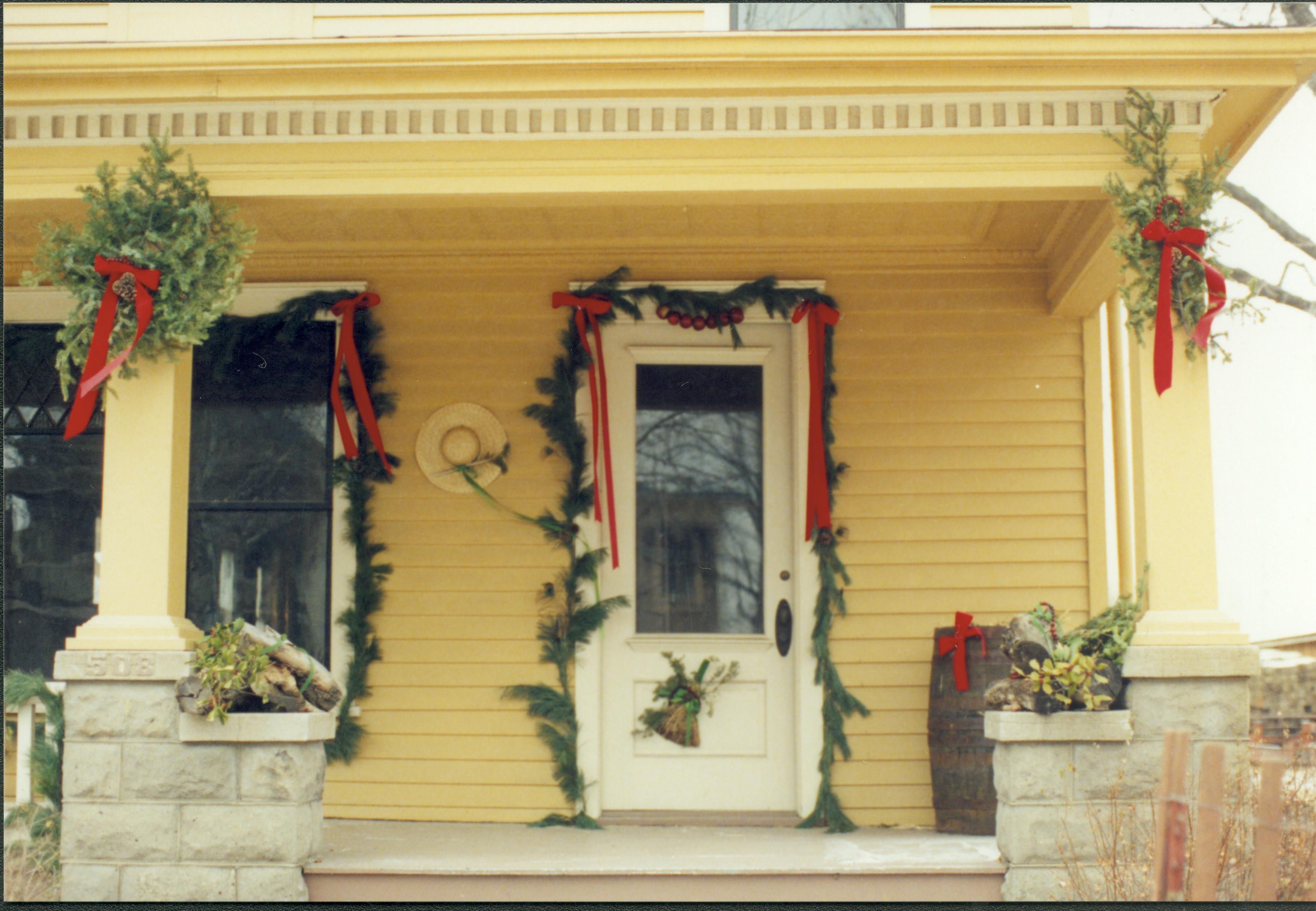 Lincoln Home NHS- Christmas in Lincoln Neighborhood Looking east from Cook lot toward Cook house west porch and door. Detail. Christmas, neighborhood, Cook, decoration, detail